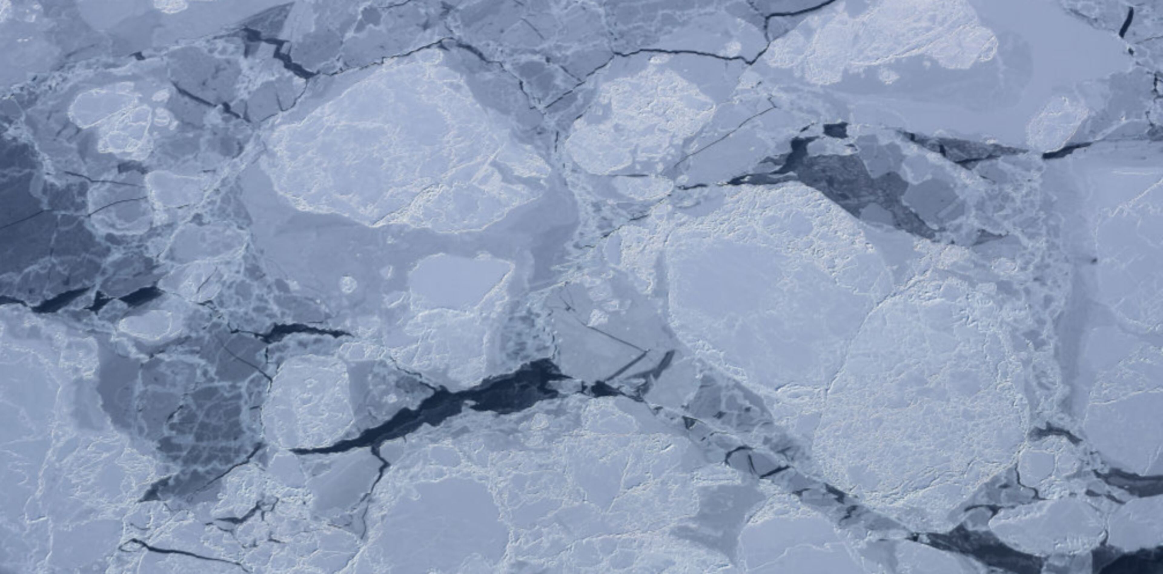 ELLESMERE ISLAND, CANADA - MARCH 29: Sea ice is seen from NASA's Operation IceBridge research aircraft on March 29, 2017 above Ellesmere Island, Canada. The ice fields of Ellesmere Island are retreating due to warming temperatures. NASA's Operation IceBridge has been studying how polar ice has evolved over the past nine years and is currently flying a set of eight-hour research flights over ice sheets and the Arctic Ocean to monitor Arctic ice loss aboard a retrofitted 1966 Lockheed P-3 aircraft. According to NASA scientists and the National Snow and Ice Data Center (NSIDC), sea ice in the Arctic appears to have reached its lowest maximum wintertime extent ever recorded on March 7. Scientists have said the Arctic has been one of the regions hardest hit by climate change. (Photo by Mario Tama/Getty Images)