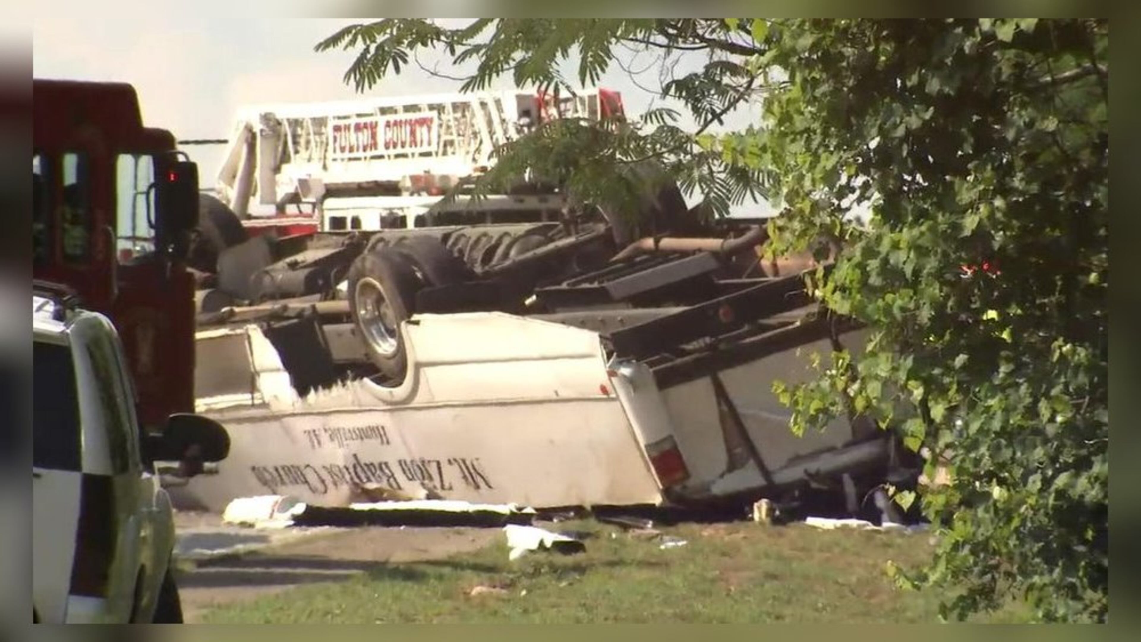 One person was killed and dozens of others were injured after an Alabama church bus carrying a youth group crashed into a black sedan on June 8 in South Fulton. (Credit: Channel 2 Action News)