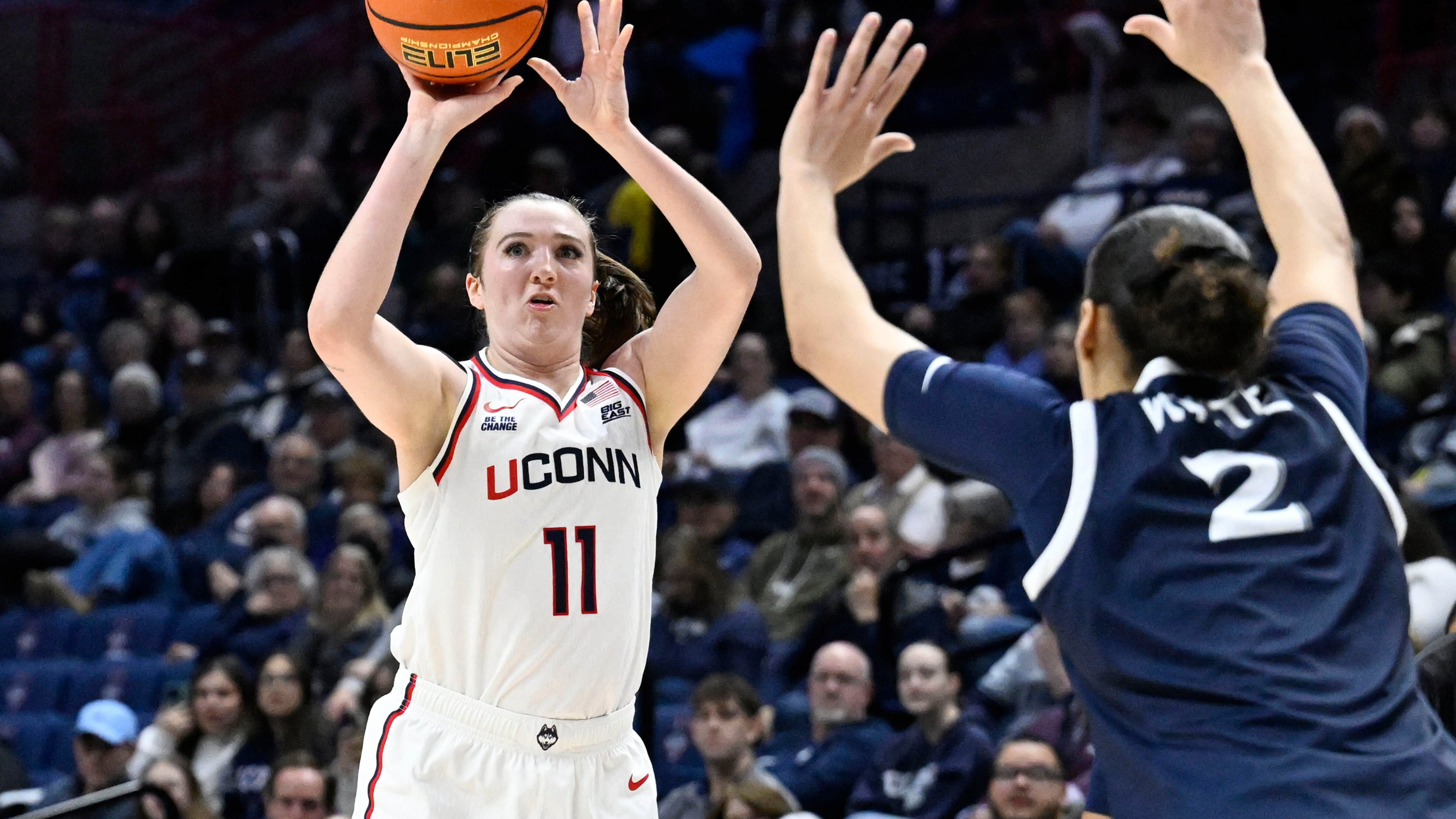 UConn guard Allie Ziebell (11) shoots as Xavier guard Savannah White (2) defends in the first half of an NCAA college basketball game, Wednesday, Jan. 28, 2026, in Storrs, Conn. (AP Photo/Jessica Hill)