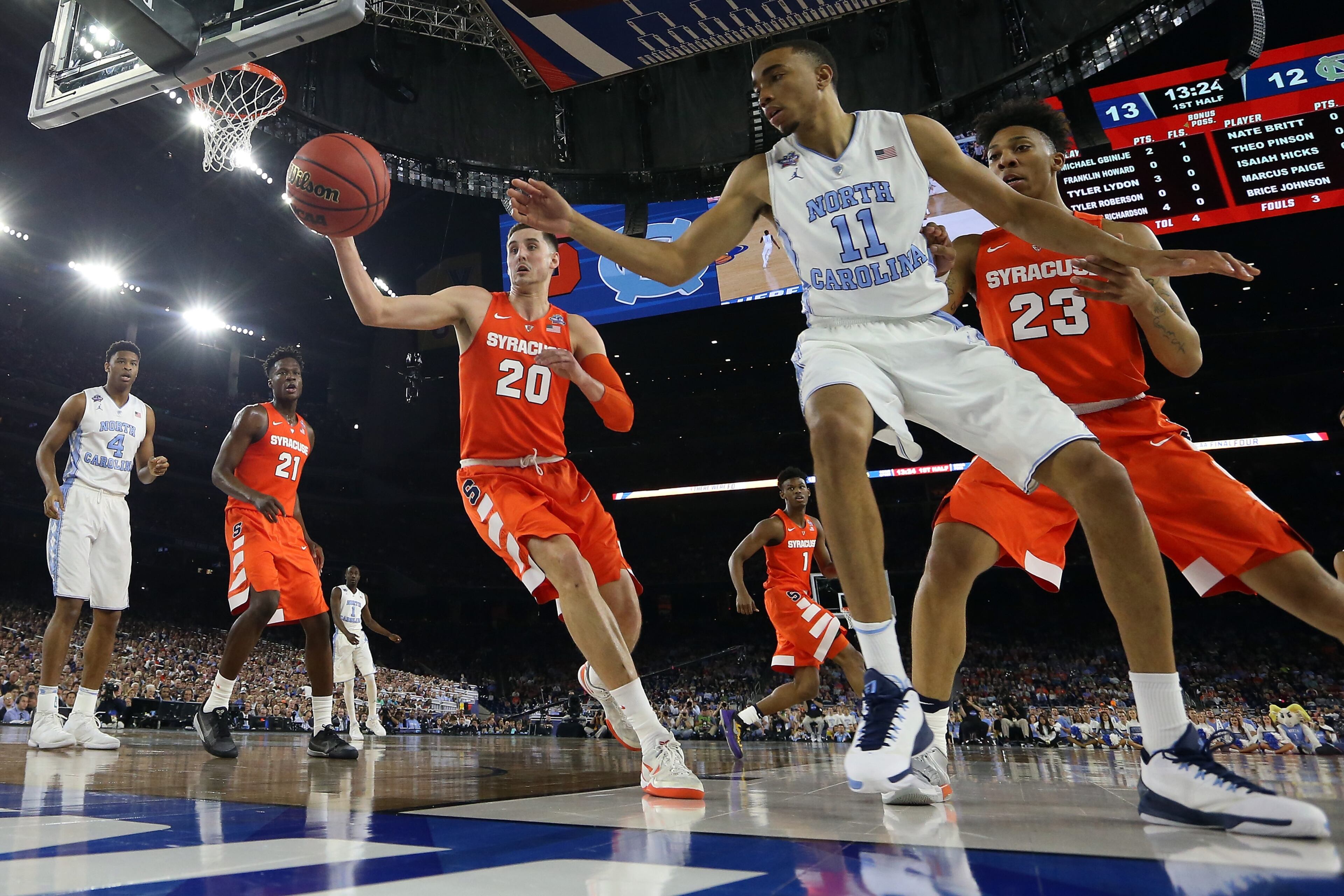 HOUSTON, TEXAS - APRIL 02: Tyler Lydon #20 of the Syracuse Orange and Brice Johnson #11 of the North Carolina Tar Heels try to prevent the ball from going out of bounds in the first half during the NCAA Men's Final Four Semifinal at NRG Stadium on April 2, 2016 in Houston, Texas. (Photo by Streeter Lecka/Getty Images)