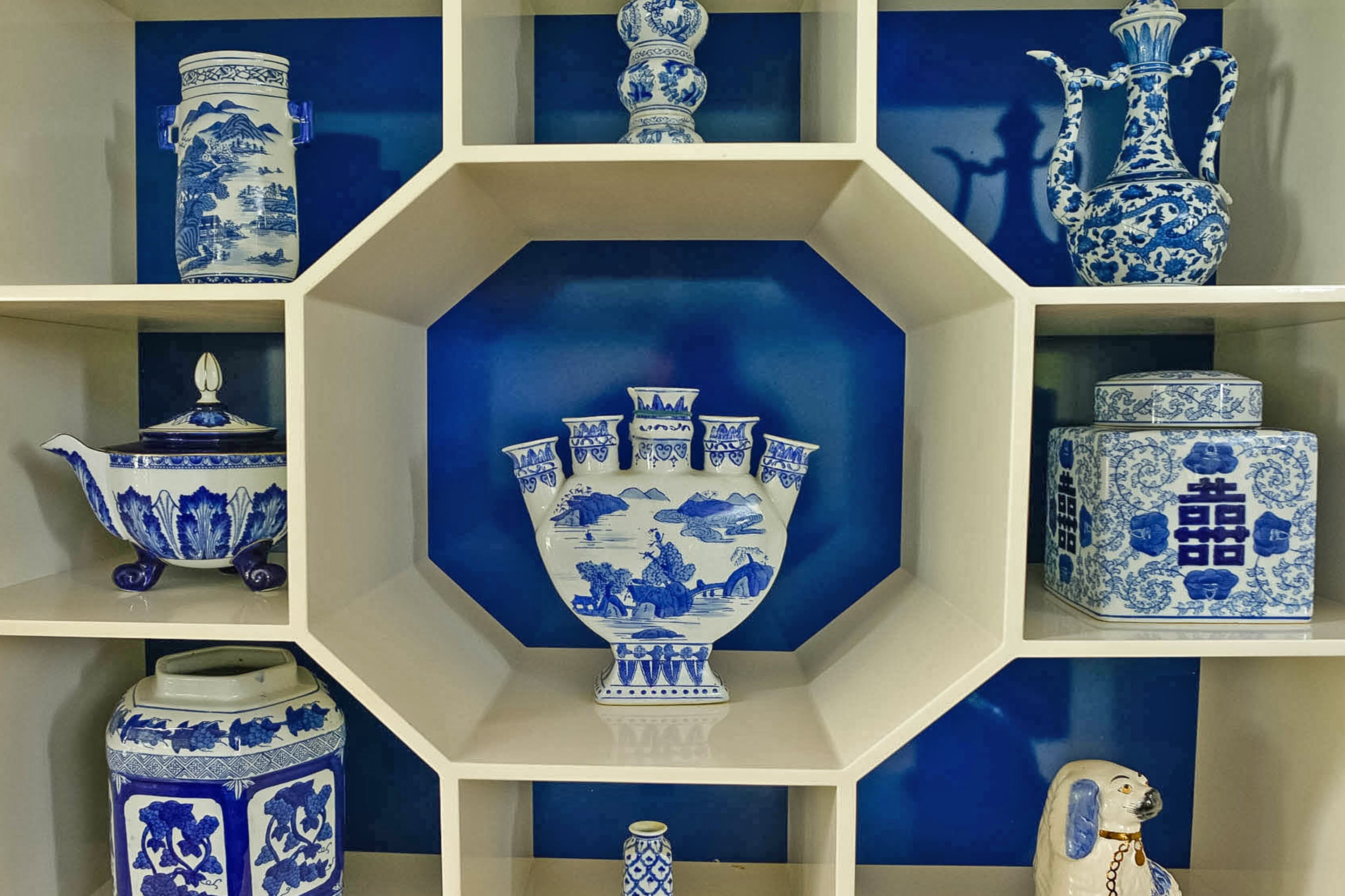 A pagoda cabinet by Drexel is filled with blue-and-white ginger jars, which Laura Nay has collected for six years. "It's constantly evolving," Laura said. She mixes reproductions and antiques and hunts for them at Scott Antique Market, antique stores, estate sales and online auctions.