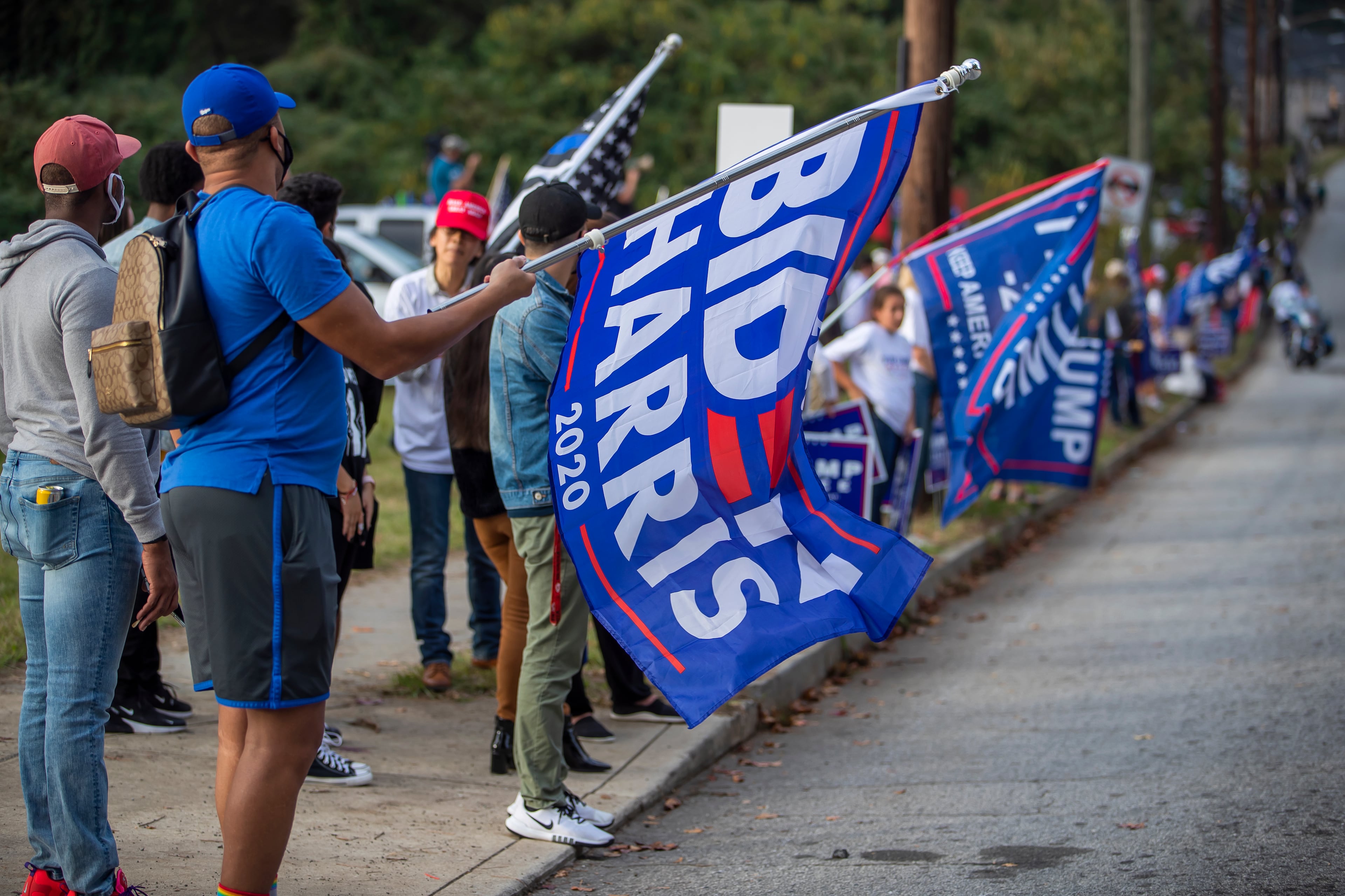 Supporters of both US President Donald J. Trump and Democratic presidential nominee Joe Biden gather outside of Lakewood Amphitheatre where Biden was holding a drive-in campaign appearance in Atlanta, Georgia, USA, 27 October 2020. Georgia has become a battleground state in the upcoming 03 November presidential election.