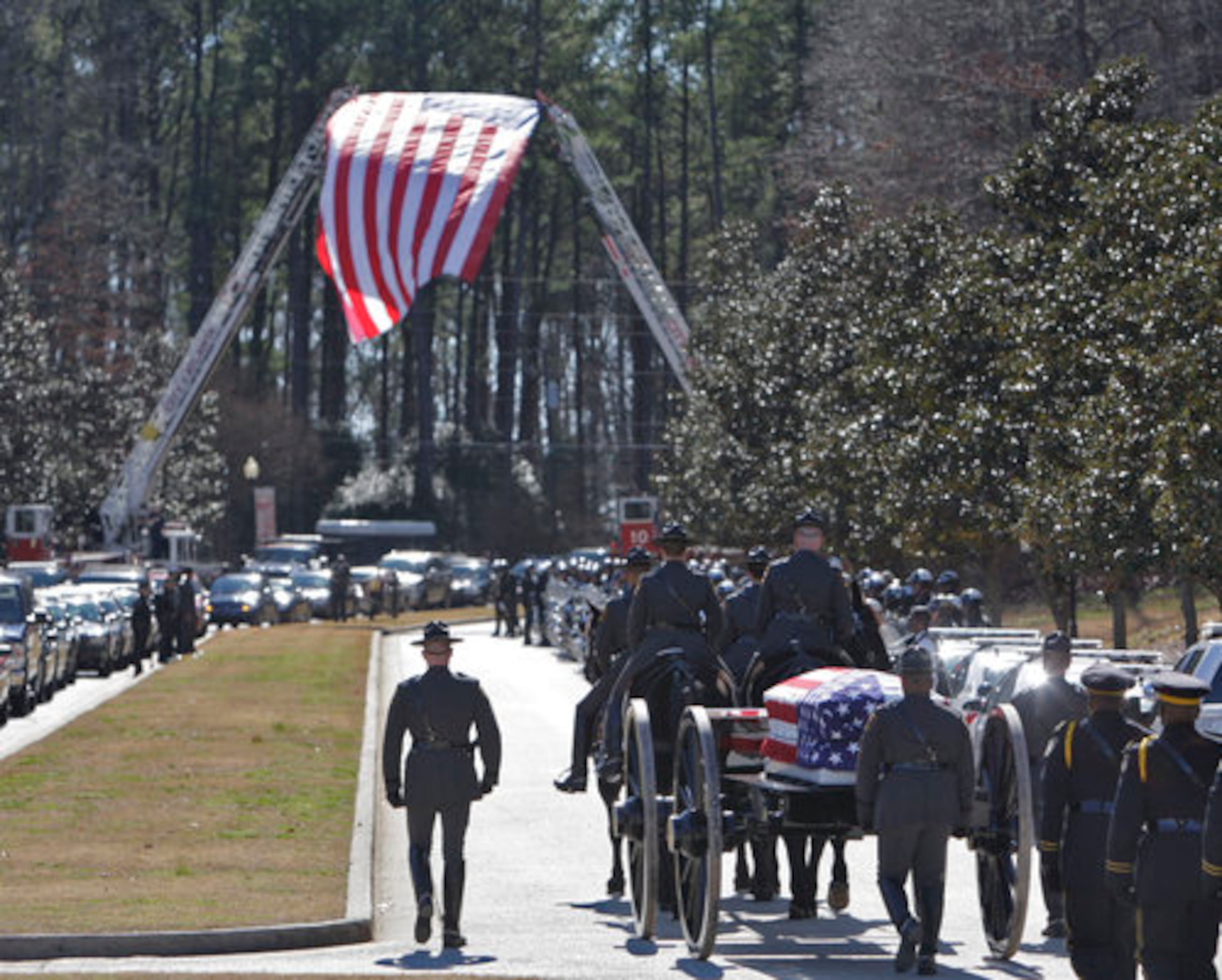 The Honor Guard marches with the horse drawn caisson after the service. The procession went out to Cascade Road where the hearse was waiting.