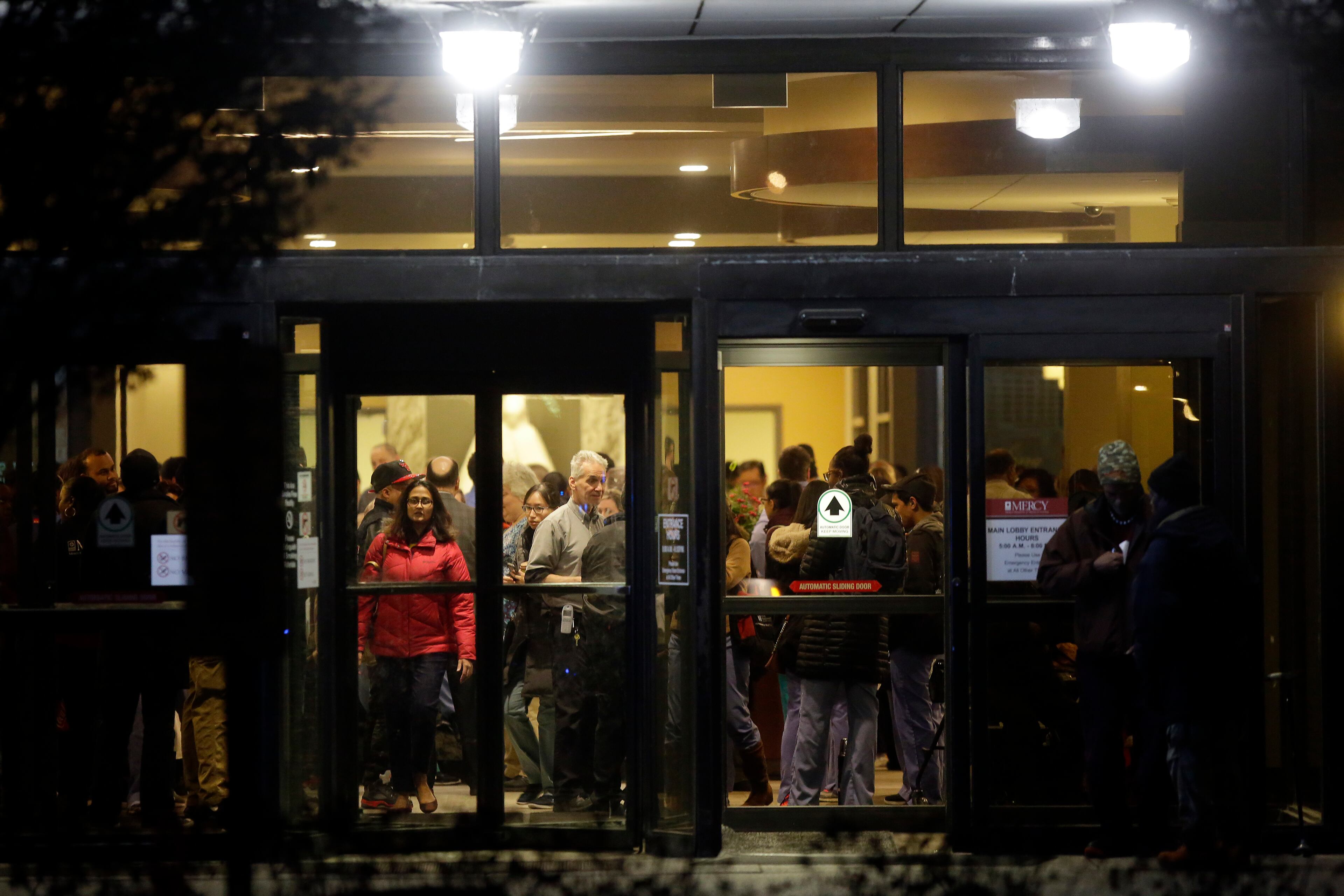 CHICAGO, IL - NOVEMBER 19: People are seen inside the main entrance of Mercy Hospital where a gunman shot multiple people on November 19, 2018 in Chicago, Illinois. Three people including Chicago police officer Samuel Jimenez were killed when a gunman went on a rampage at Mercy Hospital. (Photo by Joshua Lott/Getty Images)
