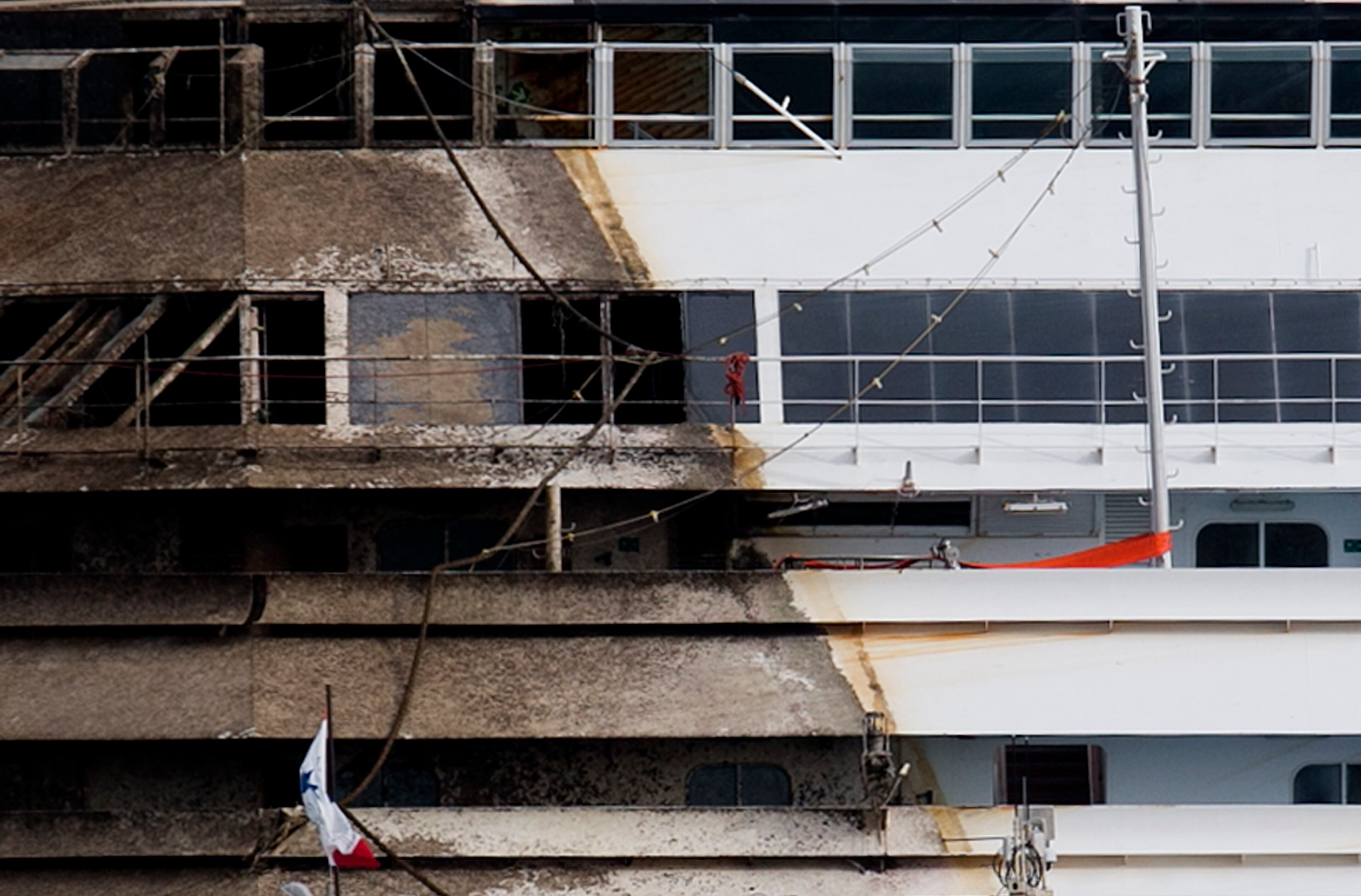 The command deck of the Costa Concordia is seen after it was lifted upright, on the Tuscan Island of Giglio, Italy, early Tuesday morning, Sept. 17, 2013. The crippled cruise ship was pulled completely upright early Tuesday after a complicated, 19-hour operation to wrench it from its side where it capsized last year off Tuscany, with officials declaring it a "perfect" end to a daring and unprecedented engineering feat. (AP Photo/Andrew Medichini)