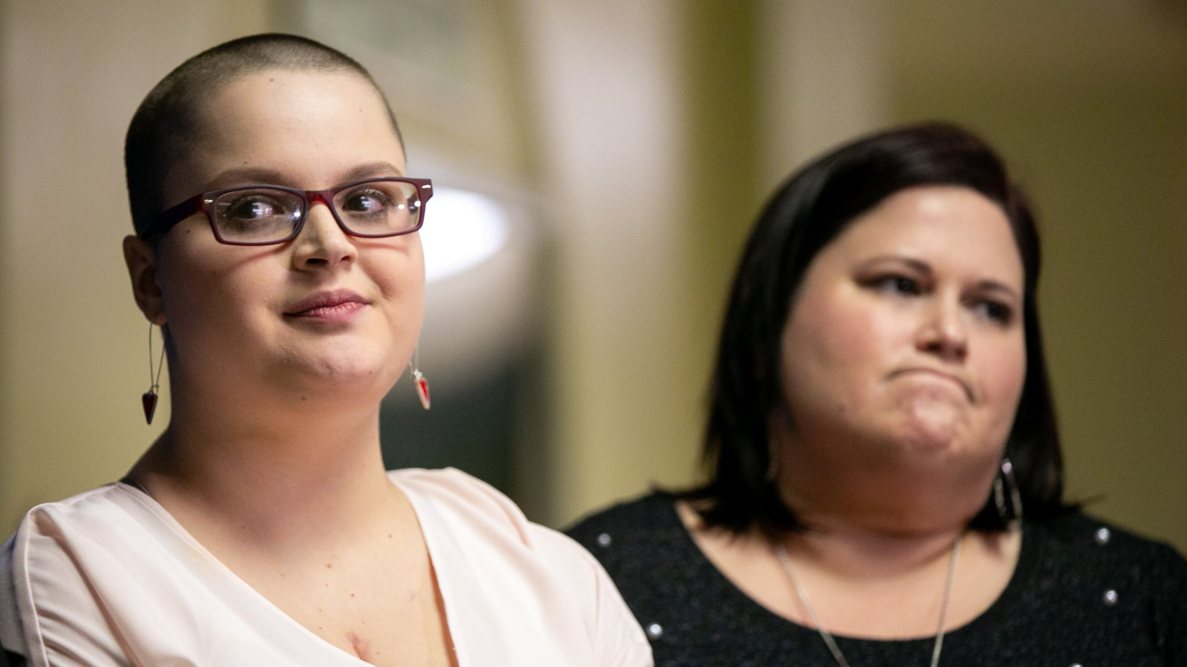 Hailie Massey, left, and her mother Laurie Wilson stand together during a press conference at the Georgia Capitol on Thursday. “The speaker used his powers to grant legislative leave for fancy dinners and fundraising for his campaign instead of trying my child’s rape case,” Wilson said. REBECCA WRIGHT / FOR THE AJC