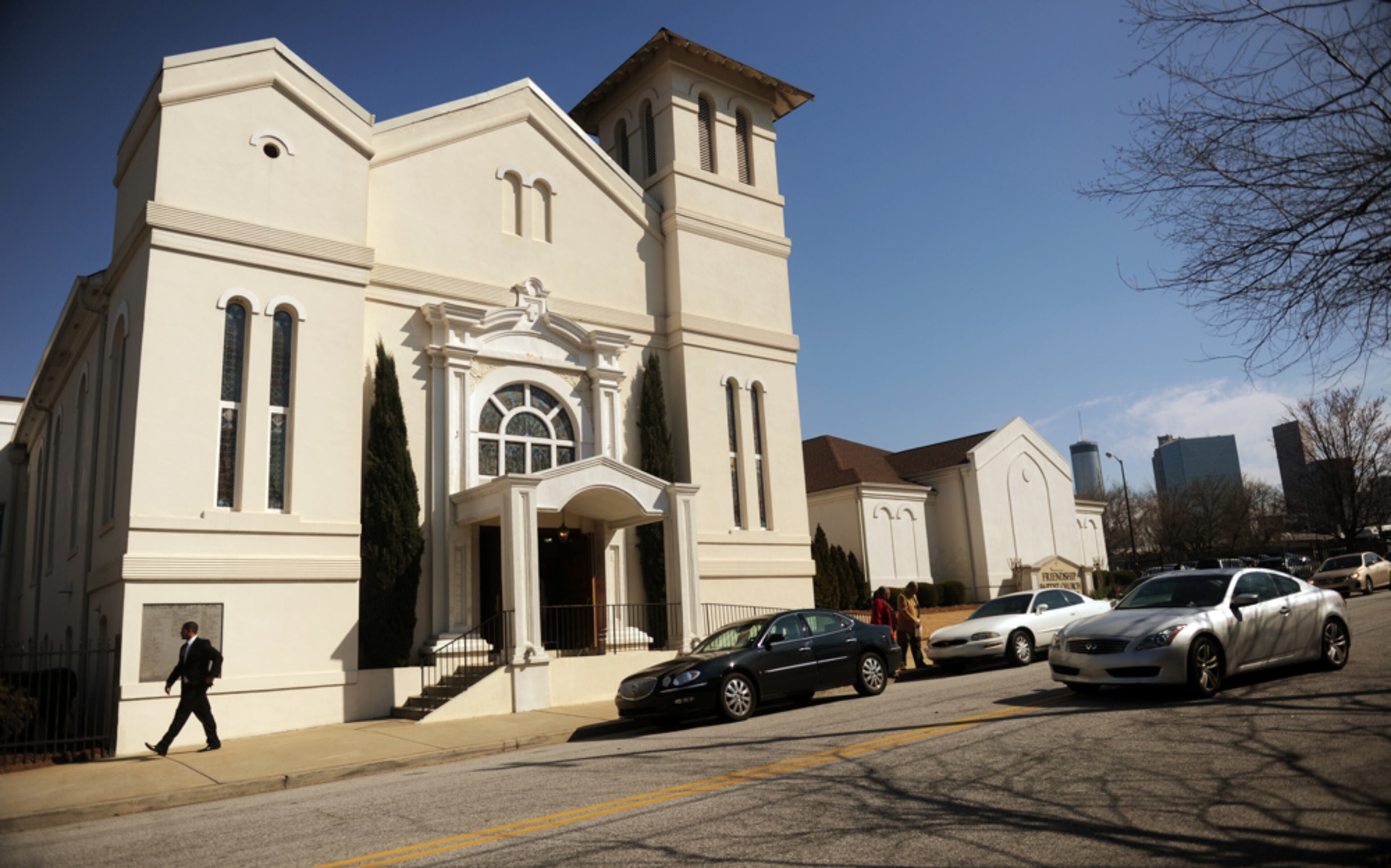 March 10, 2013 Atlanta -- People leave Friendship Baptist Church after services Sunday, March 10, 2013. Perhaps the biggest remaining stumbling block to the $1 billion proposed Falcons stadium deal isn't the Atlanta City Council, or the Georgia World Congress Center. It's two churches in the shadow of the stadium. One sits on the most favored stadium site. The other sits in the way of a road that would be rerouted to make way for the stadium. It is Friendship Baptist Church, a 150-year-old church that shares Sunday services with Sunday football games...and sometimes charges fans to use its parking spaces. Falcons owner Arthur Blank and Atlanta Mayor Kasim Reed both said they prefer the site near the churches, but they are holding out an option for an alternative site about a half-mile north if negotiations to buy the land fall through. "We're not trying to force the deal," said Reed, who said they will walk away from the site if the negotiations fall through. BITA HONARVAR / BHONARVAR@AJC.COM