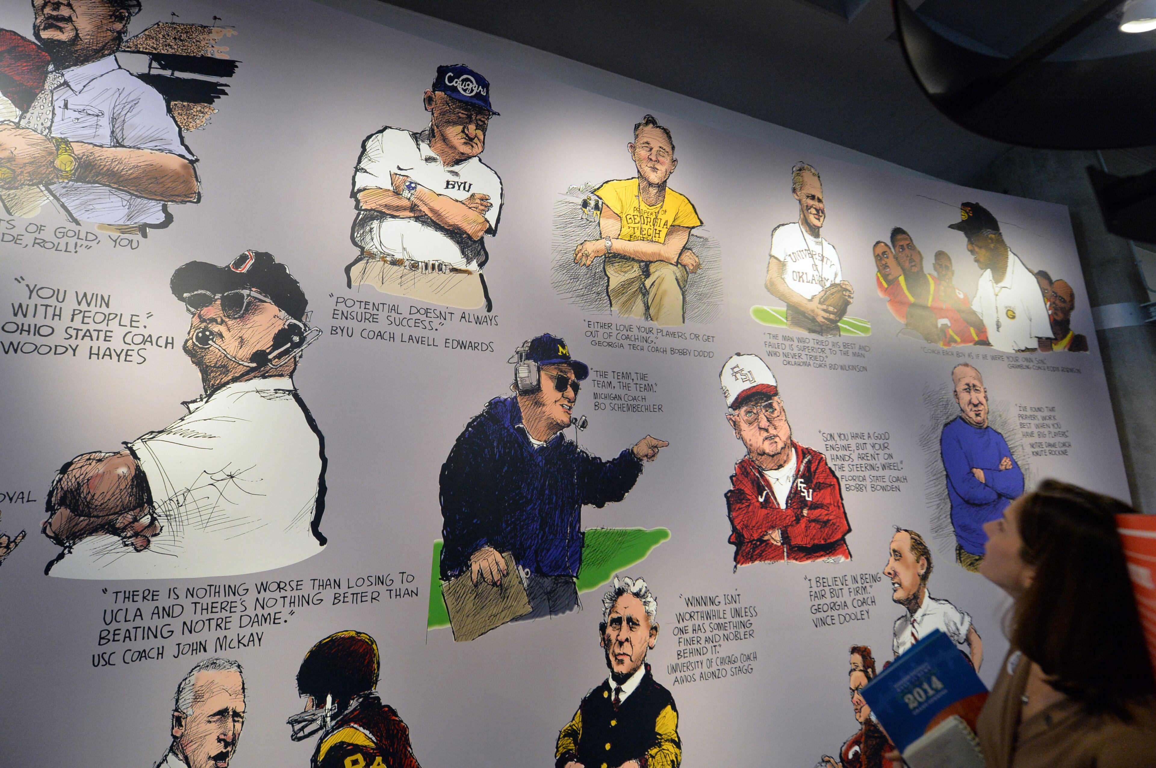 A mural by the AJC's Pulitzer Prize-winning cartoonist Mike Luckovich shows iconic coaches.