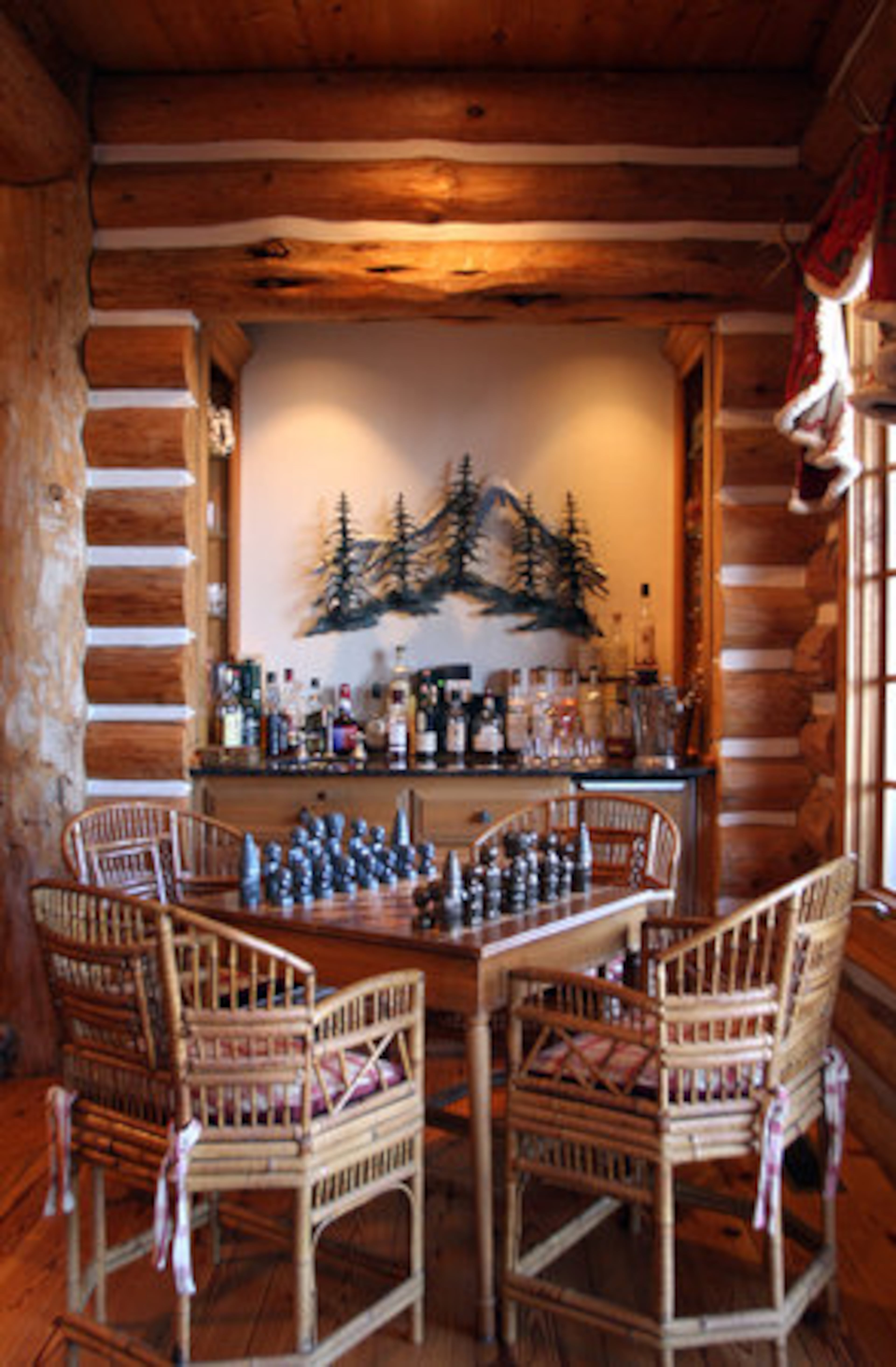 "It is so warm and cozy and you don't usually hear that of an 8,100-square-foot home," Joan Prater said. "We really live in our home and entertain in our home." Part of that entertaining is Burt Prater's collection of single malt scotch and chess sets.