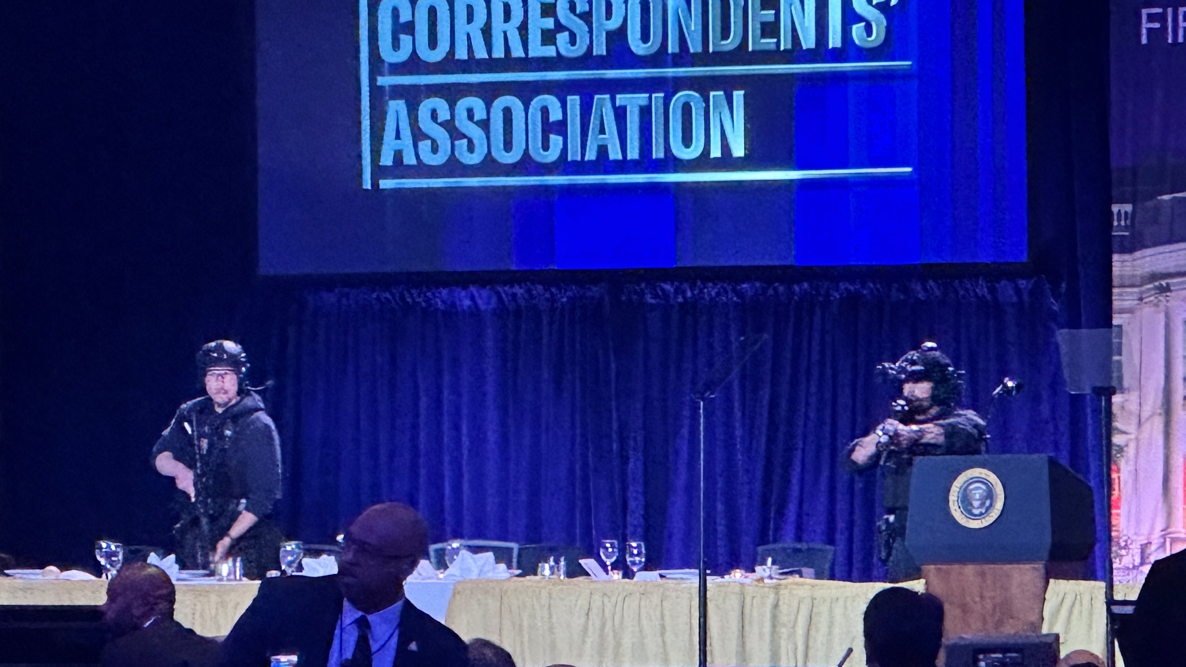 U.S. Secret Service agents respond on stage during the White House Correspondents Dinner, Saturday, April 25, 2026, in Washington. (AP Photo/Alex Brandon)