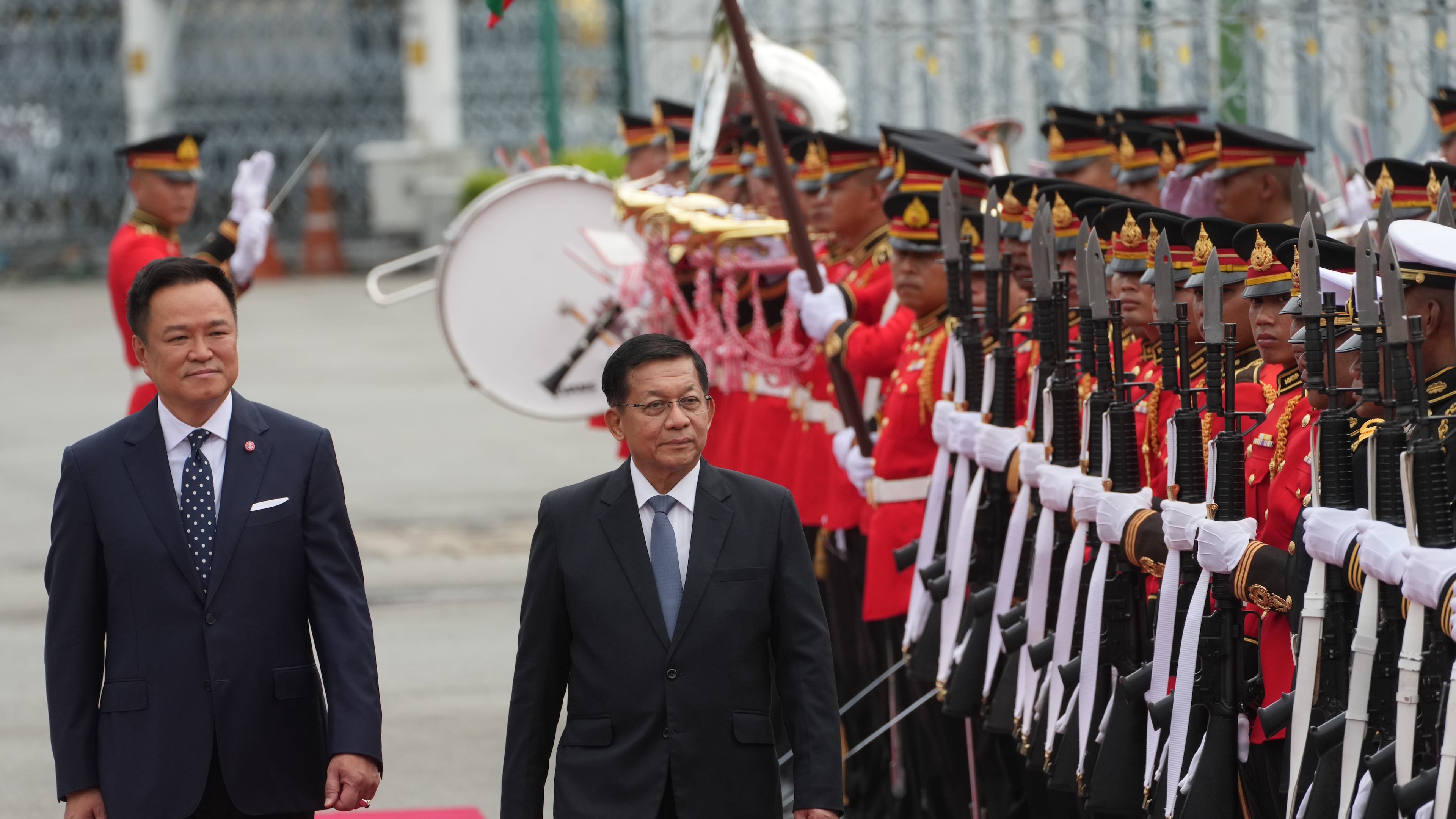 Thailand's Prime Minister Anutin Charnvirakul, left, and Myanmar's President Min Aung Hlaing review an honor guard during a welcome ceremony at the Government House in Bangkok, Thailand Thursday, Aug. 6, 2026. (AP Photo/Sakchai Lalit)