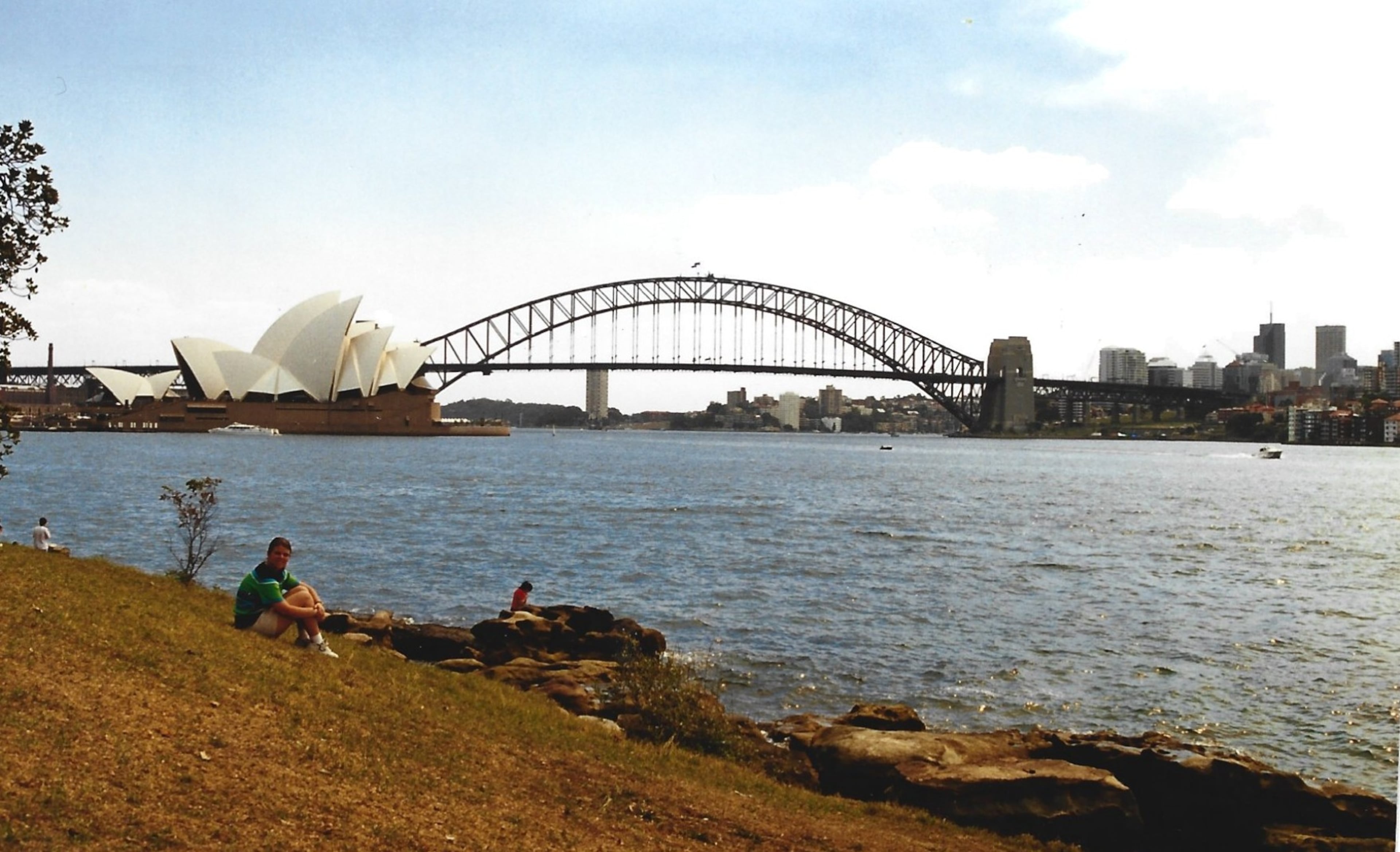 Heather sits in front of the Sydney Opera House on her first trip to visit Steve in Australia. (Courtesy of Steve Leo)