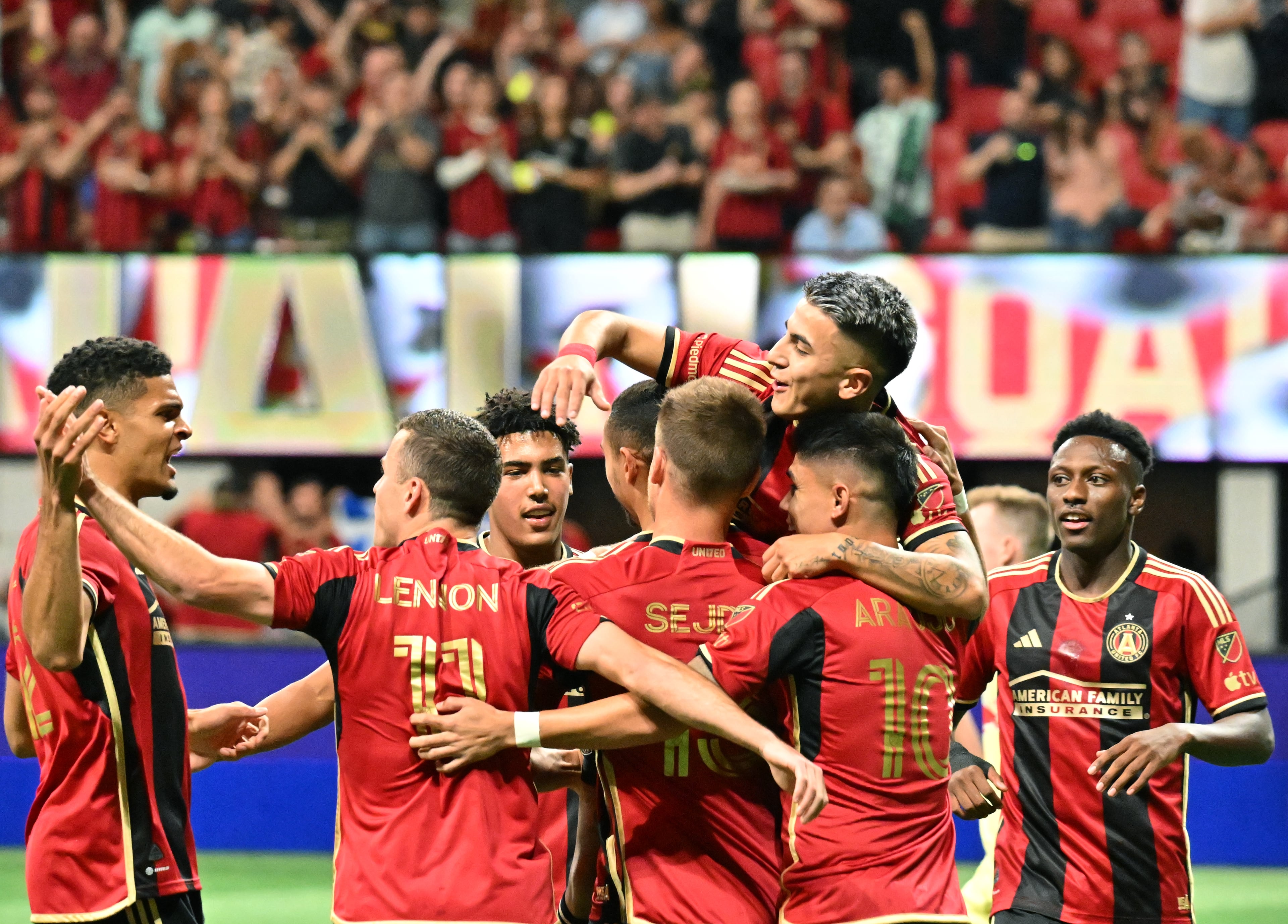 Atlanta United's forward Giorgos Giakoumakis (7) celebrates with teammates after scoring a goal against the New York Red Bulls at Mercedes-Benz Stadium Saturday. Atlanta United won 1-0.(Hyosub Shin / Hyosub.Shin@ajc.com)