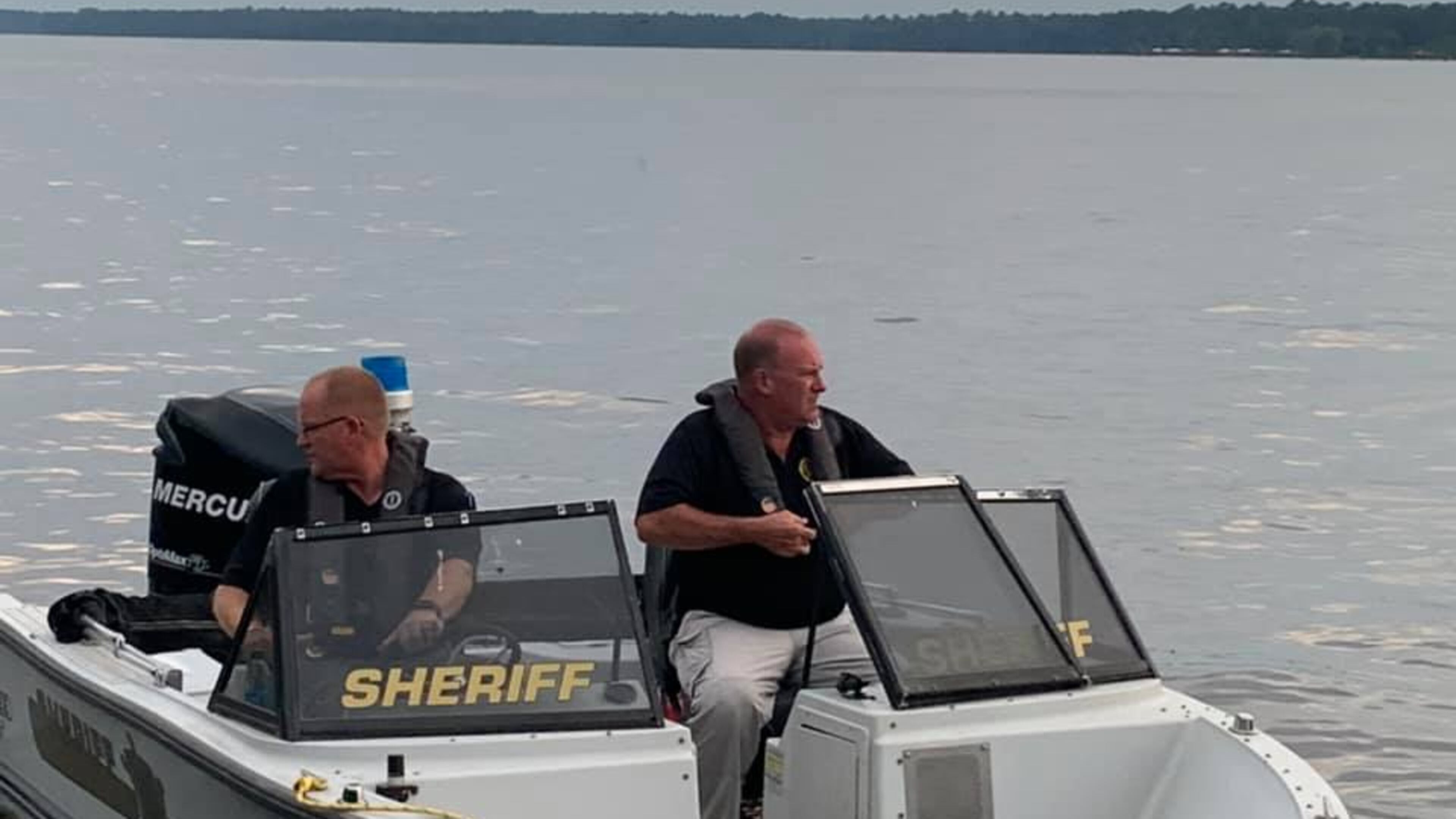 Deputies with the Crisp County Sheriff's Office search Lake Blackshear for Abraham Levy, 25, of Atlanta, whose body was found two days after he disappeared.