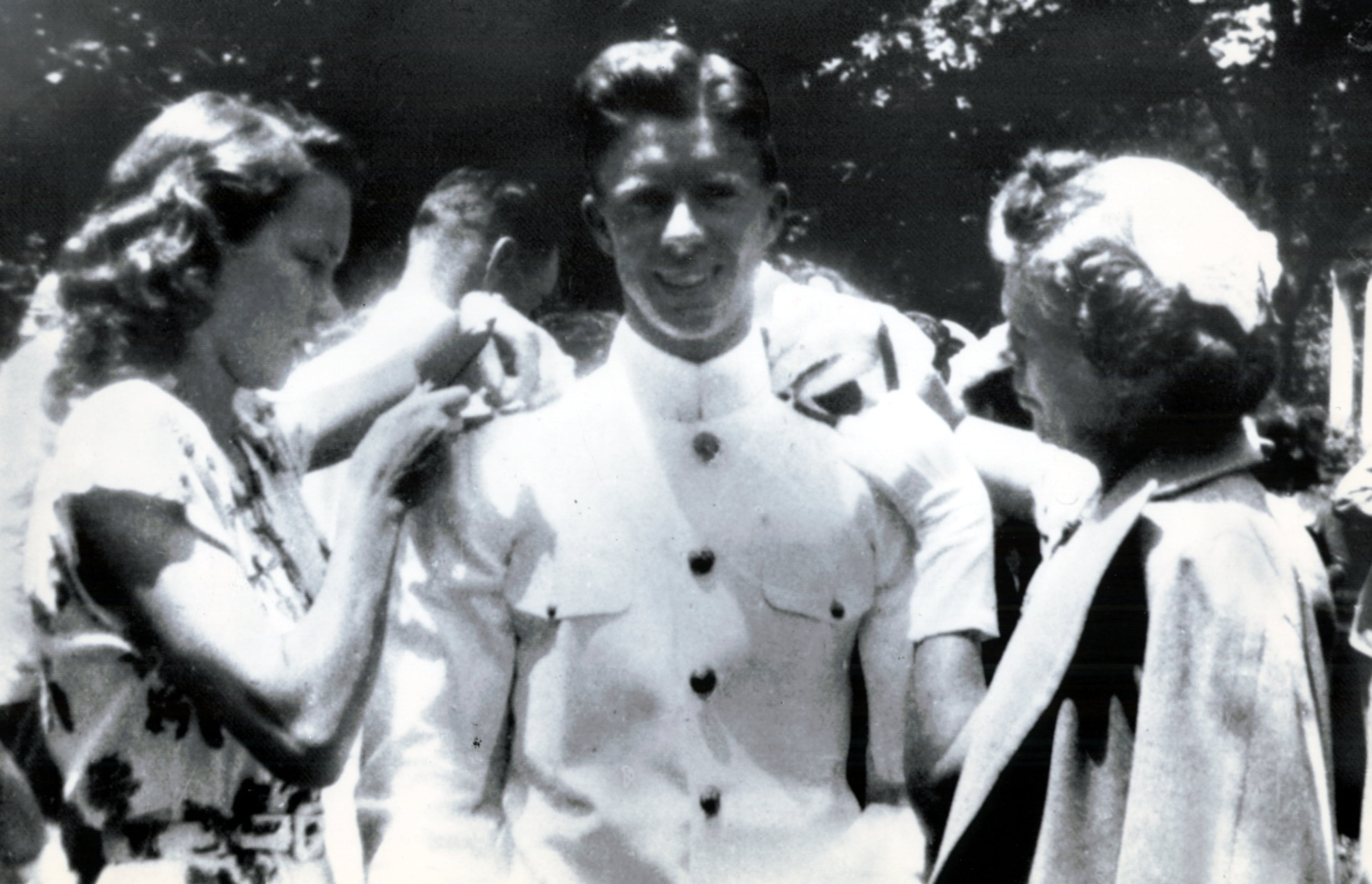 Jimmy Carter was admitted to the U.S. Naval Academy in Annapolis in 1943, during World War II. Here, he gets his bars pinned on by his wife, Rosalynn, left, and his mother, Lillian Carter, at the U.S. Naval Academy. Jimmy met fellow Plains resident Rosalynn Smith because she was a childhood friend of his sister, Ruth. For the first seven years of their marriage, the young couple lived in Norfolk, Virginia, Philadelphia, Pennsylvania, New London, Connecticut, Pearl Harbor, Hawaii, San Diego, California, and Provincetown, Massachusetts. (AP)