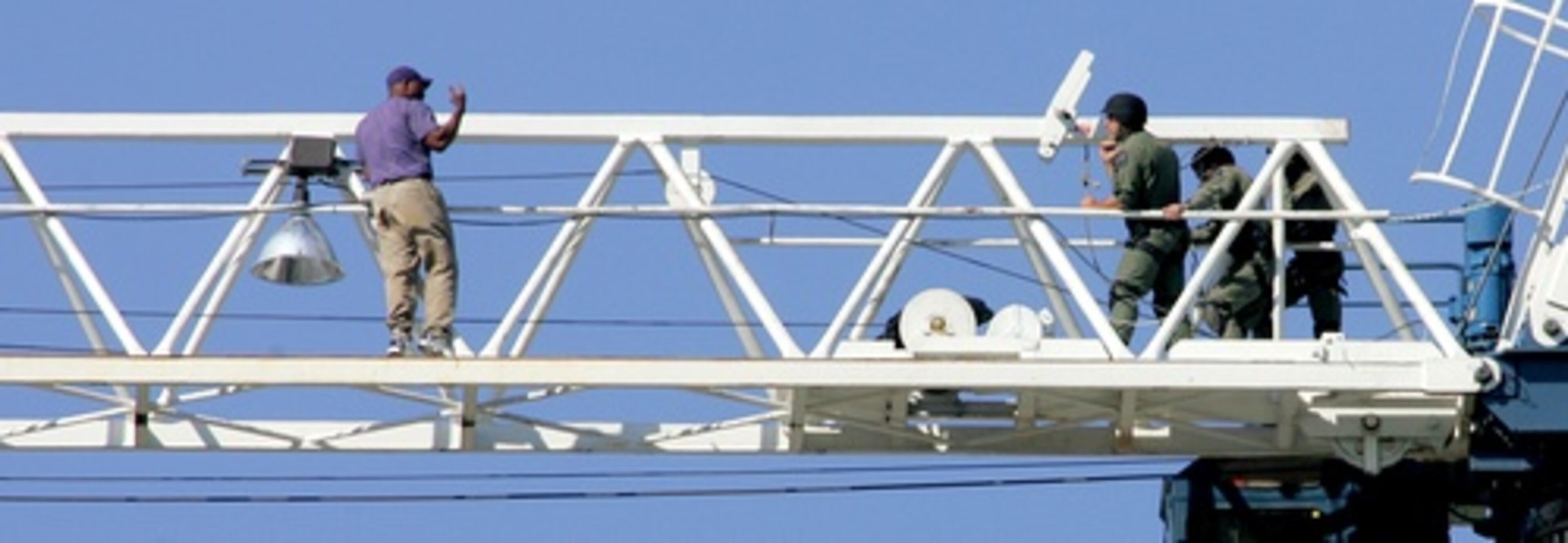 He paralyzed Buckhead traffic by sitting atop the construction crane on Peachtree Street.