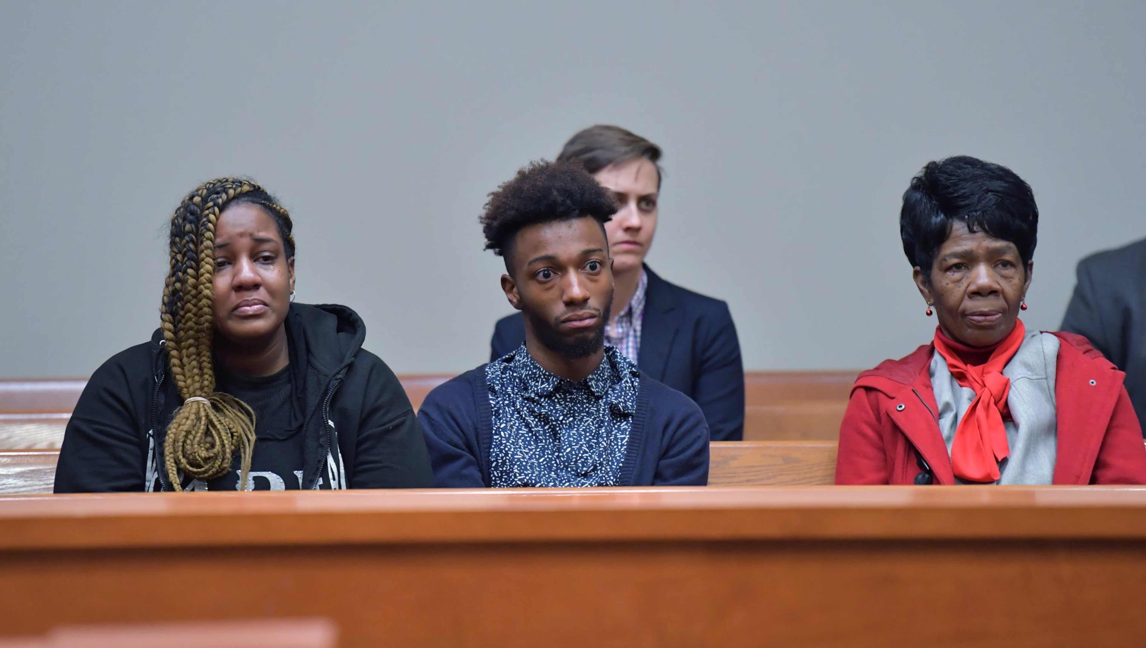 Christopher Williams’ family members (from left) niece Arriyana Williams, nephew Xavier Williams and mother Cathy White react during a hearing before Superior Court Judge Asha F. Jackson at DeKalb County Superior Court in Decatur on Thursday.