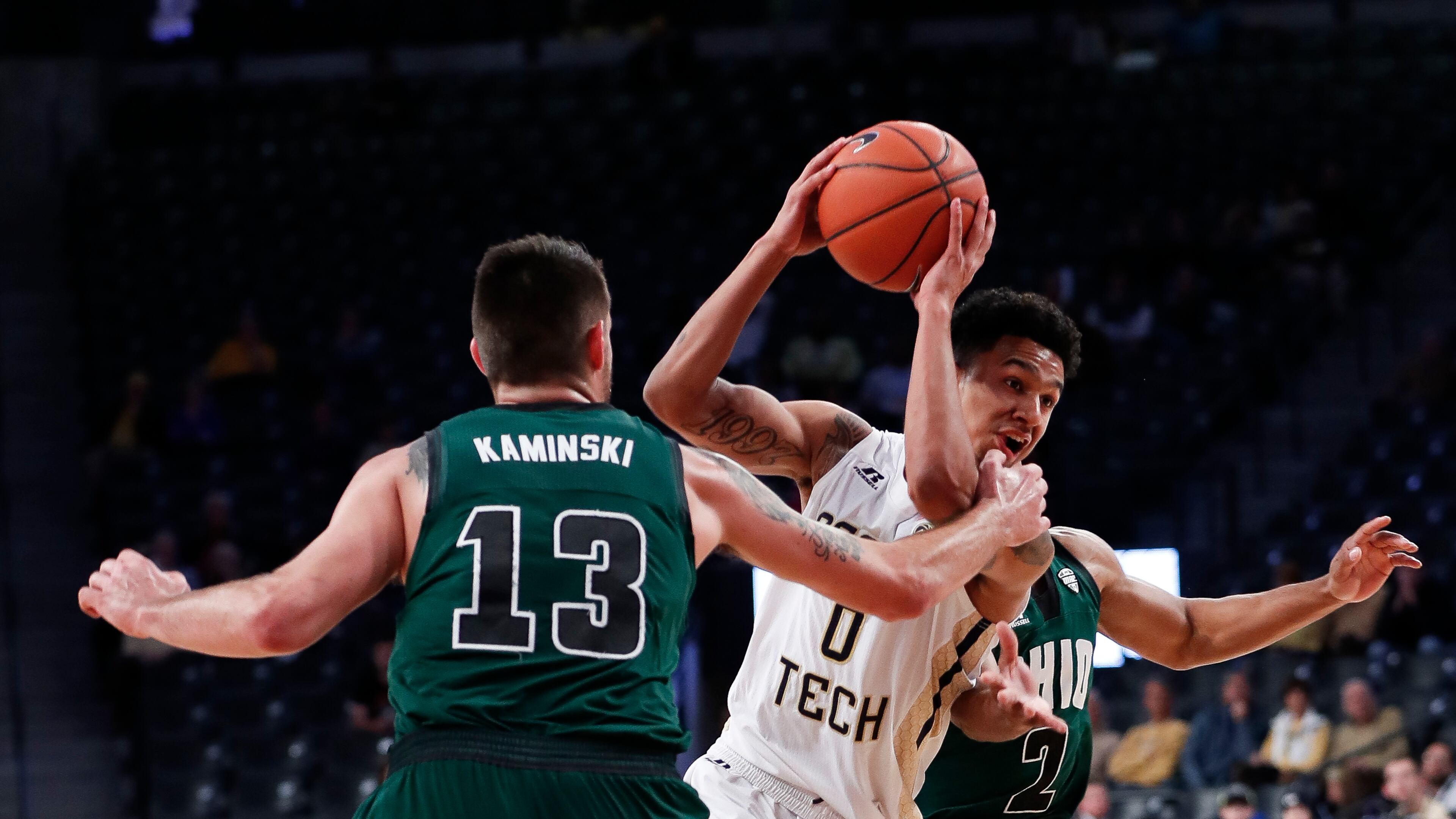 Georgia Tech guard Justin Moore (0)drives against Ohio forward Kenny Kaminski (13) in the first half of an NCAA college basketball game Friday, Nov. 18, 2016, in Atlanta. (AP Photo/John Bazemore)