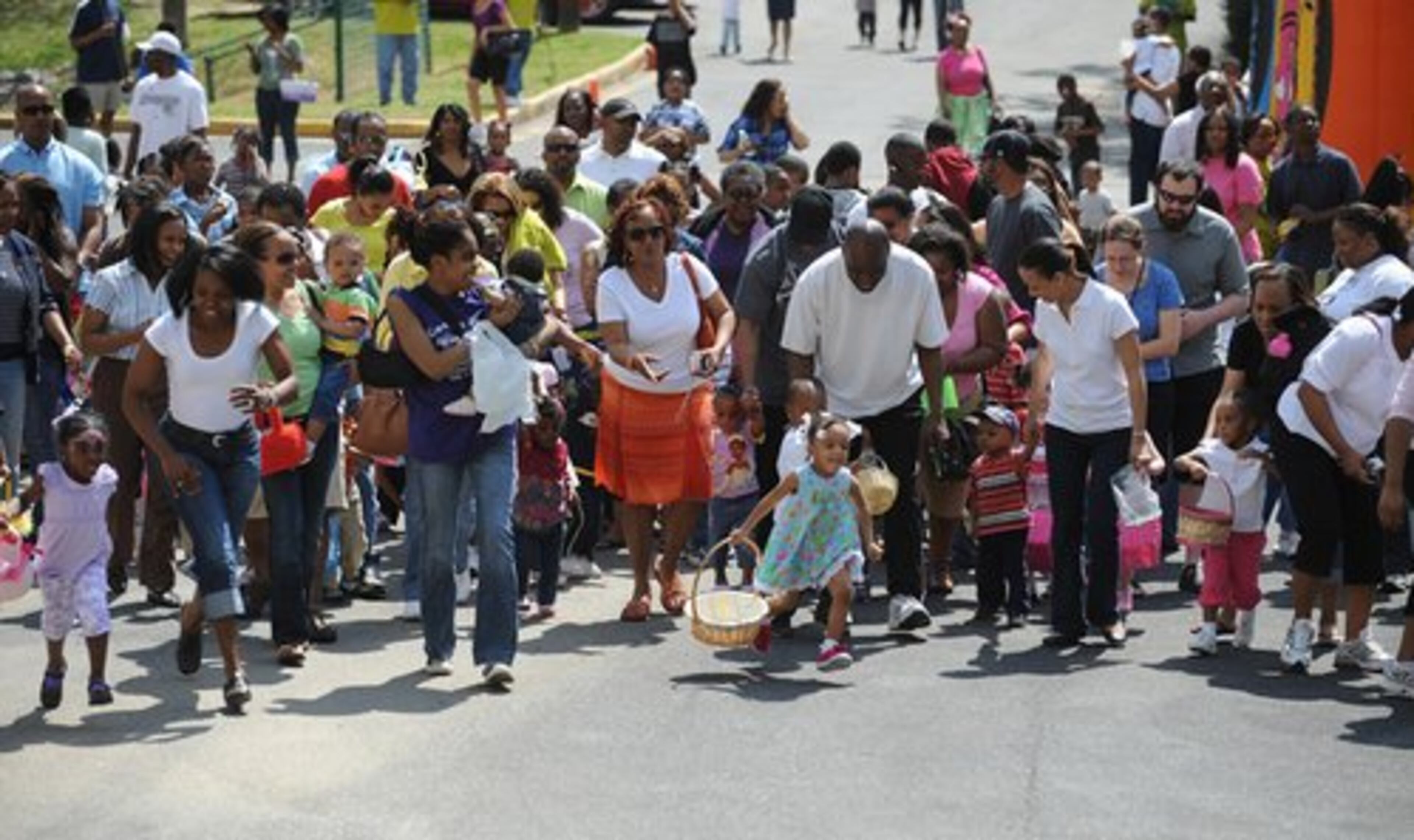 Kids and parents run to find Easter eggs during the Easter Egg Hunt at Cascade United Methodist Church Saturday. More than 1,000 plastic eggs were hidden as about 500 parents and their children attended the event.
