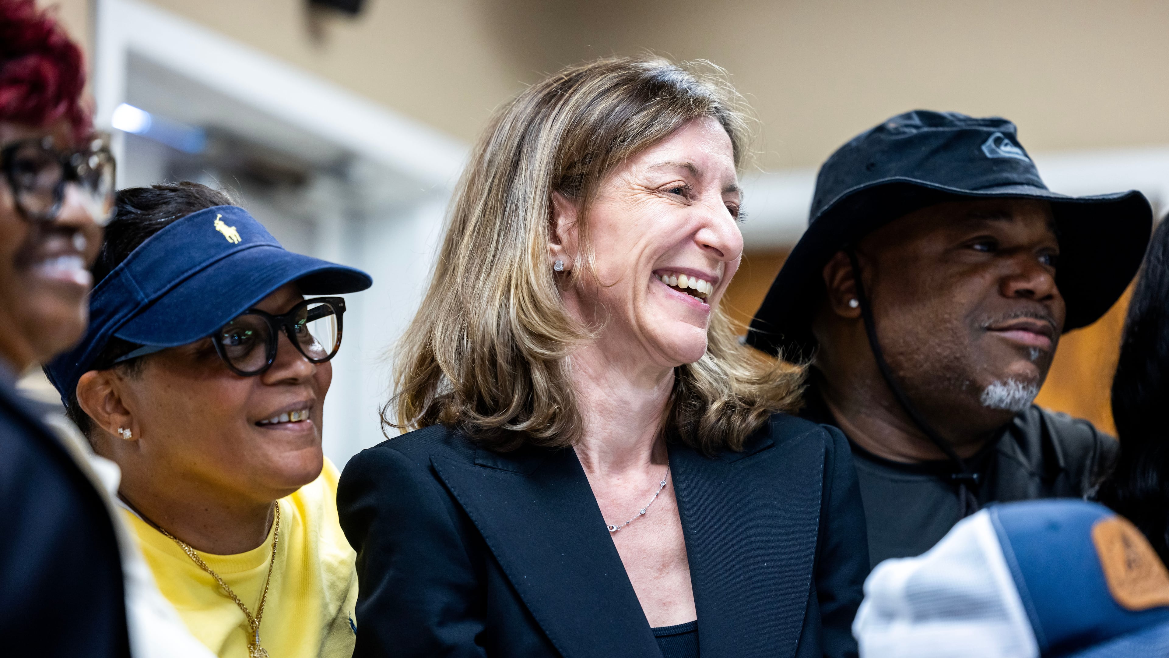 FILE - Former Rep. Elaine Luria, D-Va., stands in a group photo with members of the Amalgamated Transit Union Local 1177 on July 9, 2026, in Norfolk, Va. (AP Photo/Kendall Warner, File)