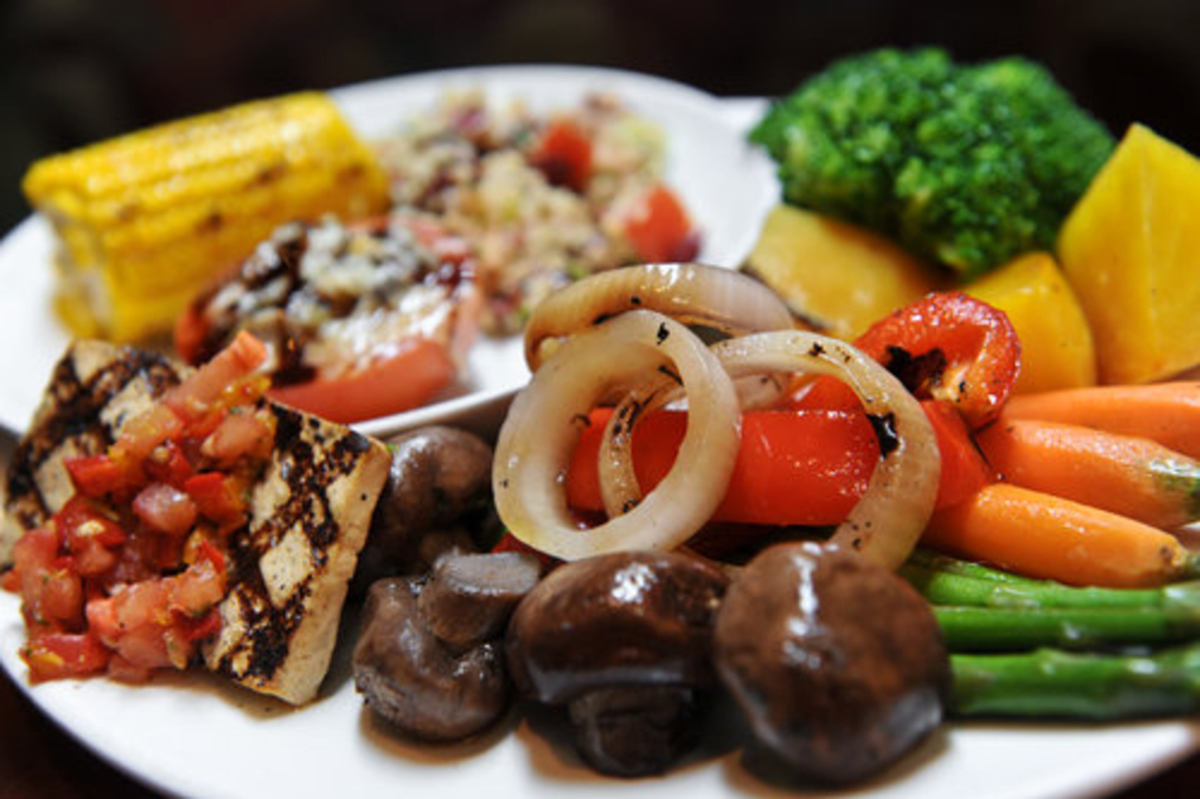 The farmer's market vegetable plate -- including summer corn, tomato tapenade, grilled ponzu tofu and toasted almond tabboule -- at Seasons 52 in Dunwoody, a health-conscious spot John Kessler cites as having "mostly lackluster food, clumsy service, moderately high prices." One star.