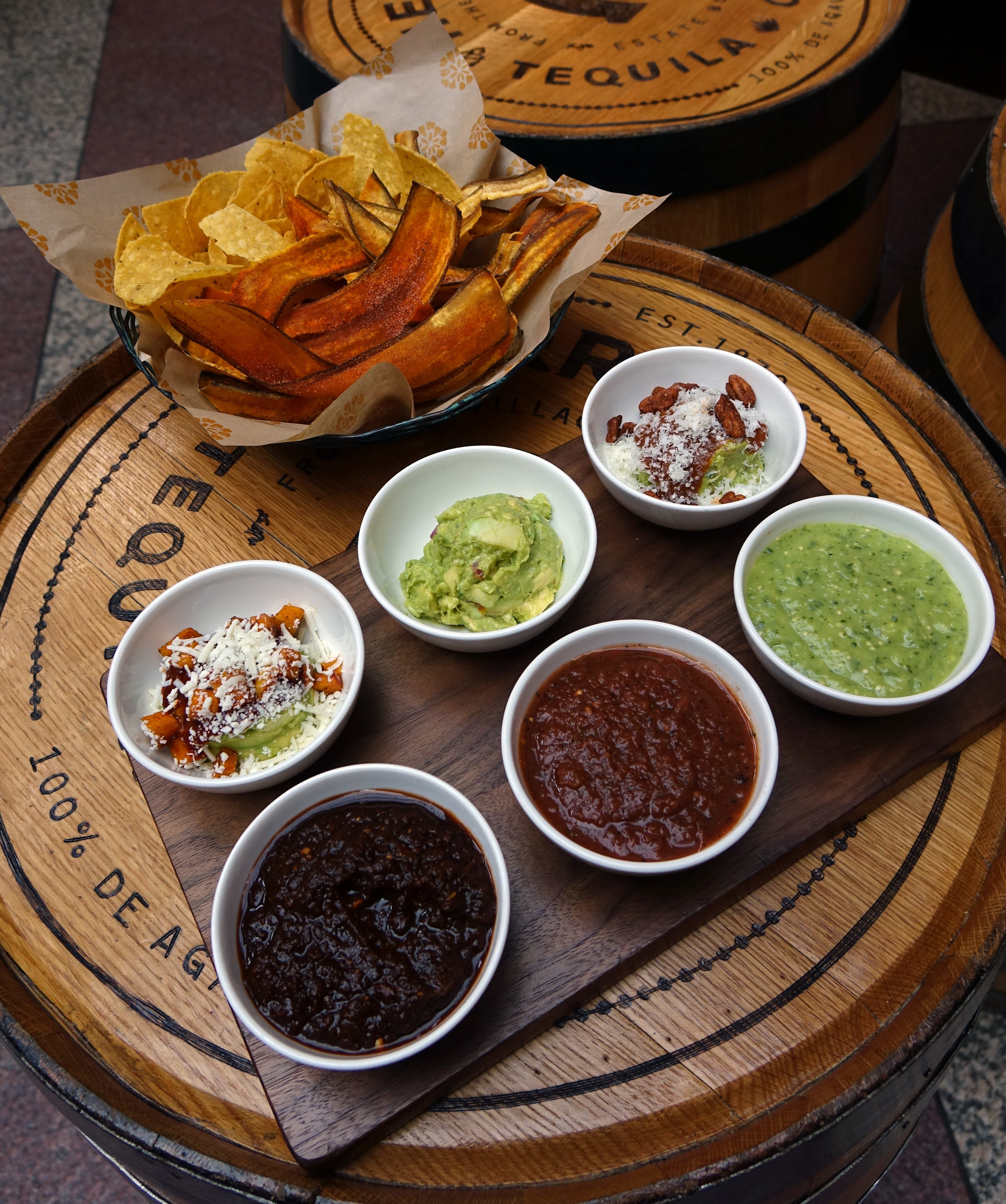 The guacamole and salsa tasting at Alma Cocina features three types each of guacamole and salsa with a basket of plantain chips and tortilla chips. / Photo by Fifth Group Restaurants