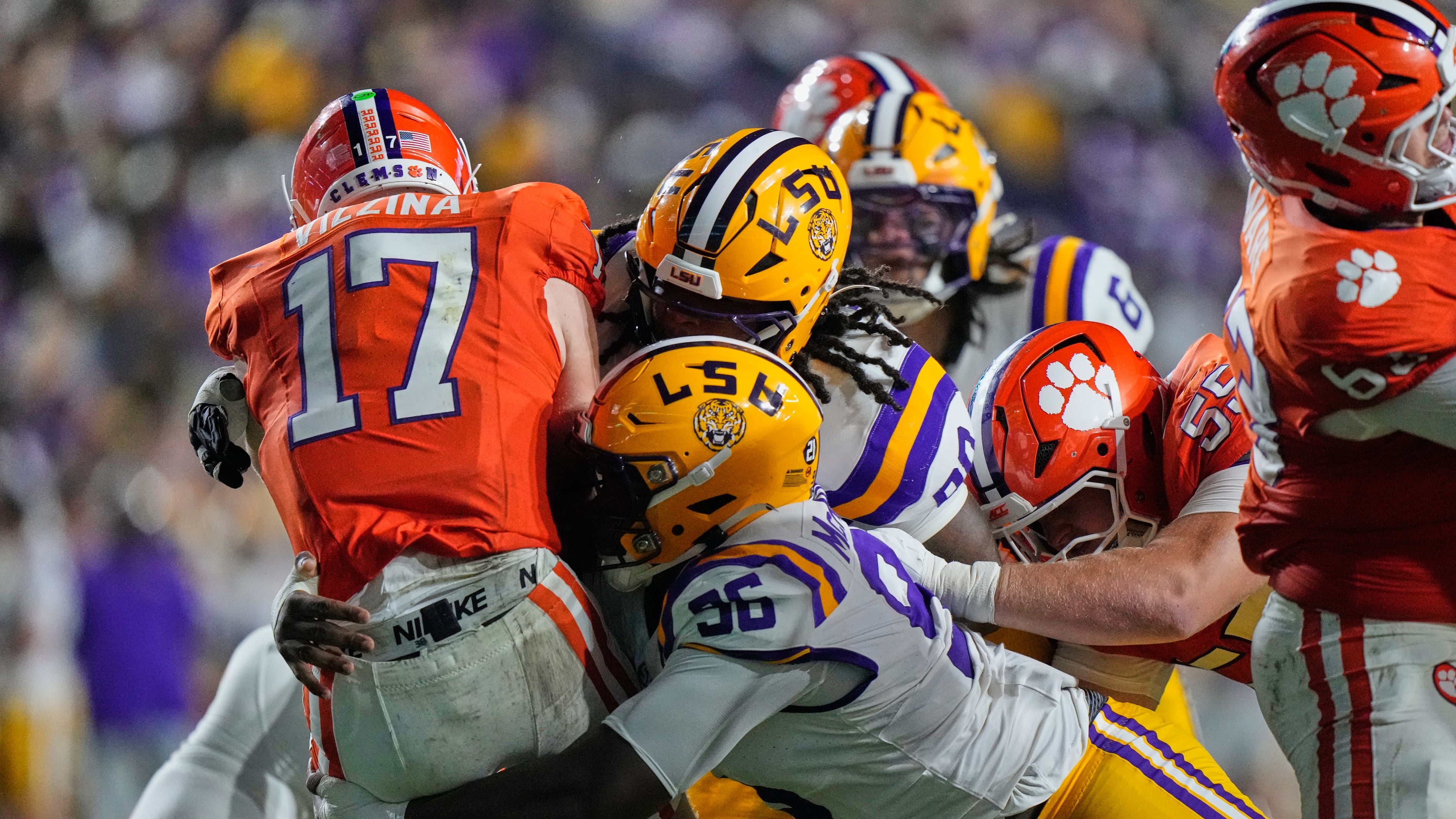 Clemson quarterback Christopher Vizzina (left) is sacked by LSU defensive tackles Dominick McKinley and Stephiylan Green in the first half of the NCAA football game, Saturday, Sept. 5, 2026 in Baton Rouge, La. (Gerald Herbert/AP)