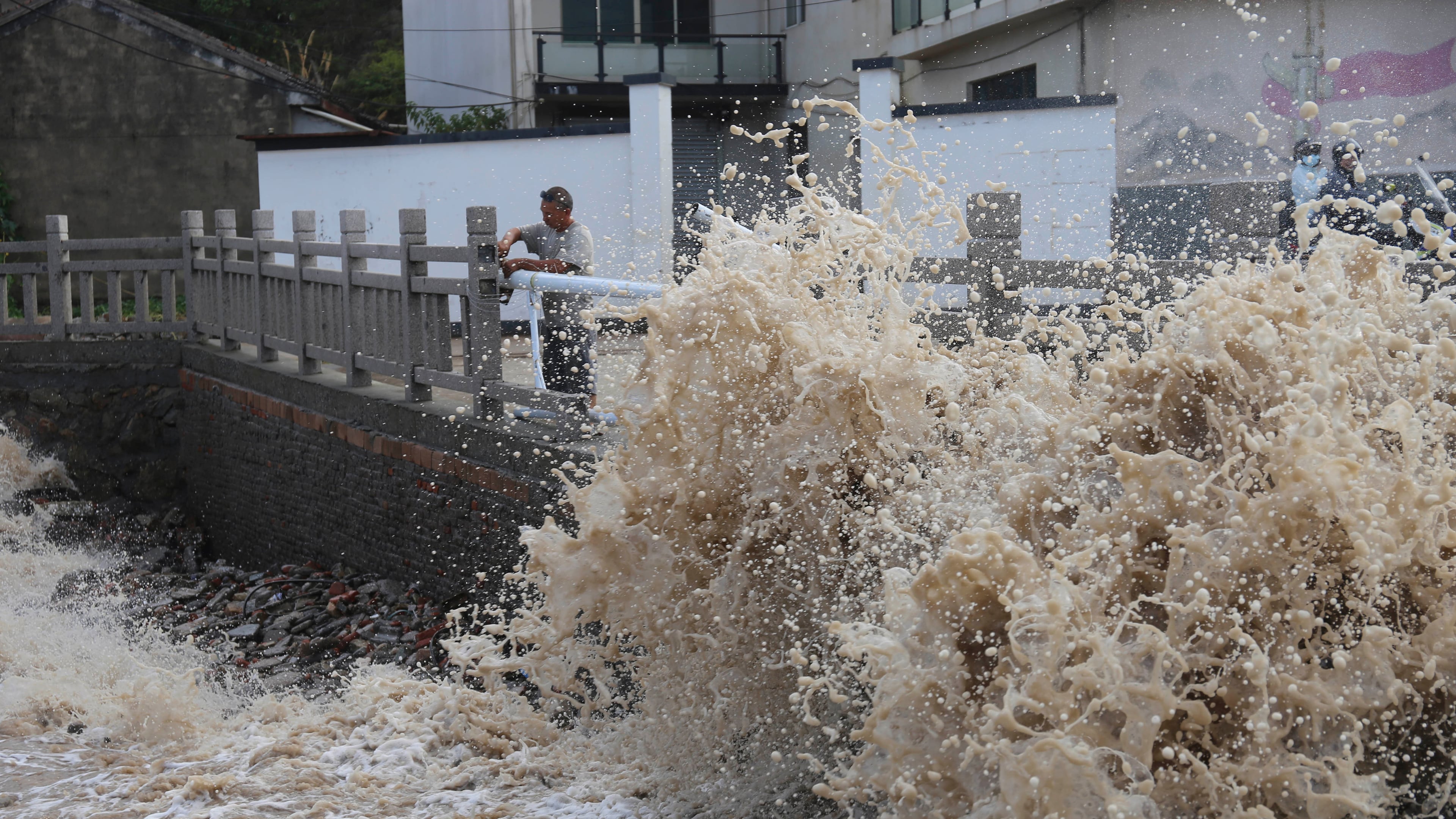Huge waves crash on the coastline ahead of Typhoon Bavi in Wenling in eastern China's Zhejiang province, Friday, July 10, 2026. (Chinatopix Via AP) CHINA OUT