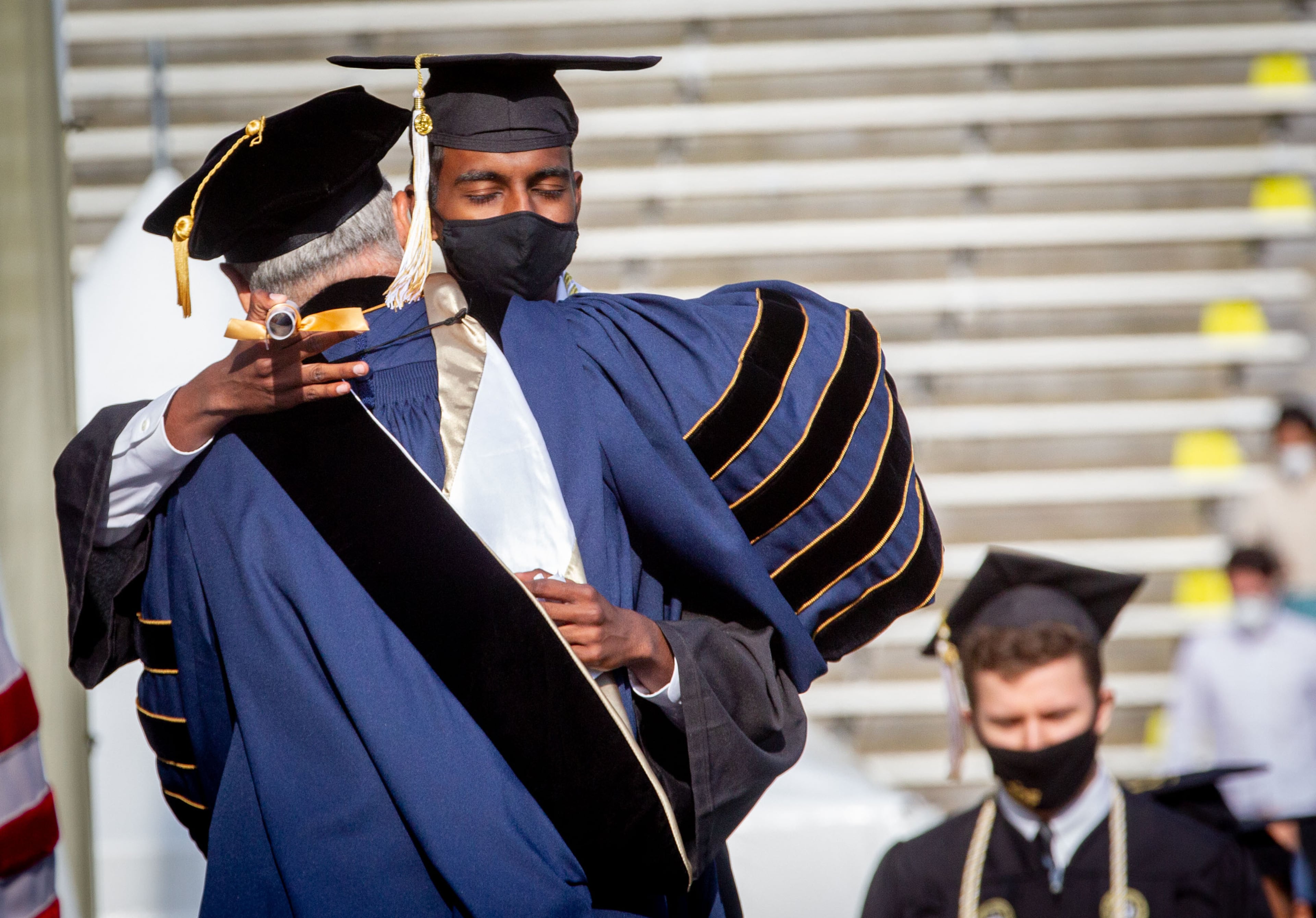 Sidartha Rakuram gets a hug from Georgia Tech President Ángel Cabrera after Rakuram received his diploma during the 2021 commencement ceremony at Bobby Dodd Stadium on Saturday, May 8, 2021. Two ceremonies were held Saturday for bachelor’s degree recipients, and master's and doctoral graduates' ceremonies were held Friday. (Photo: Steve Schaefer for The Atlanta Journal-Constitution)