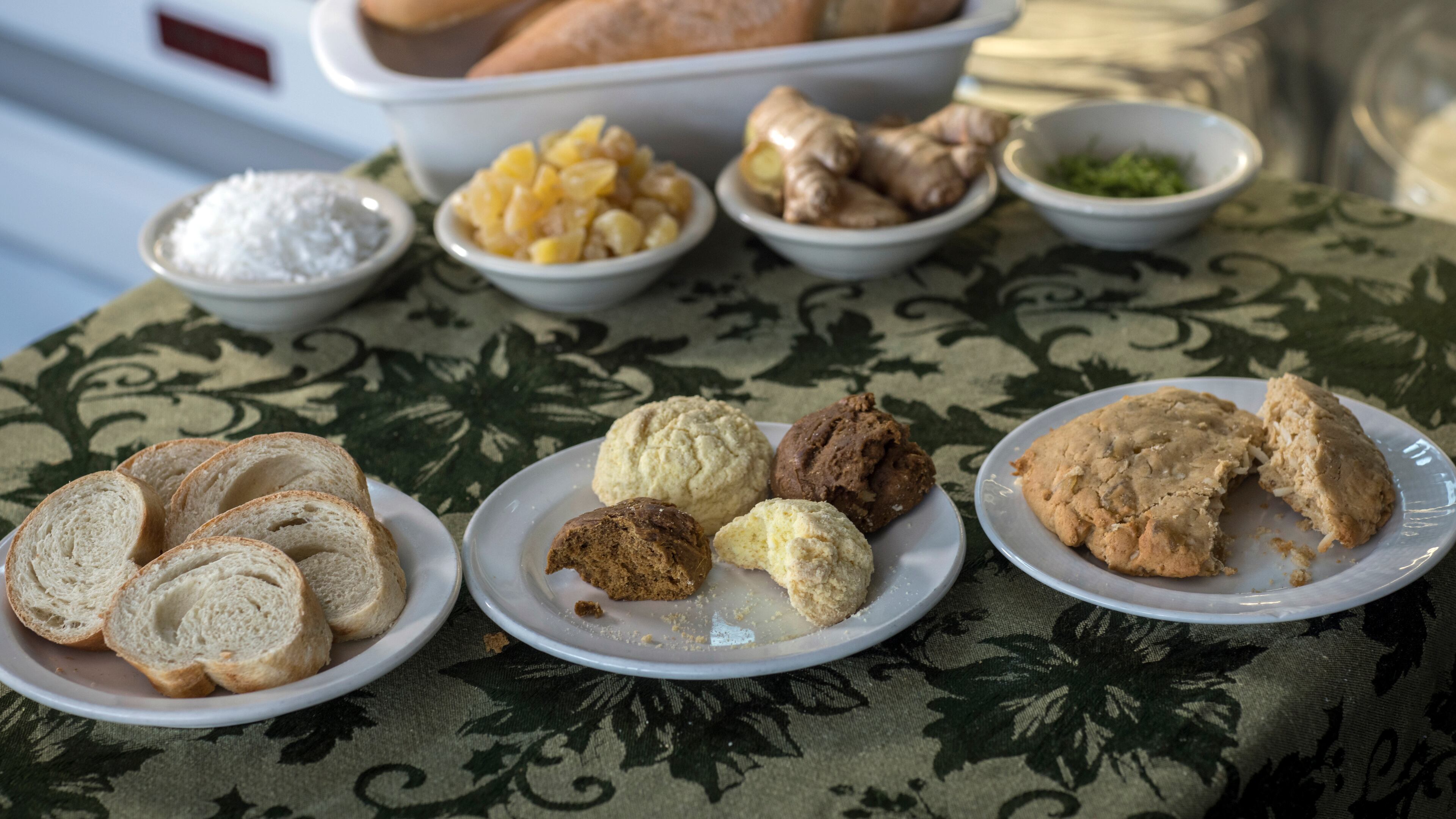 Savannah's Unforgettable Bakery and Café, which is owned by Haitian native Belinda Baptiste, creates items such as vegan Bon Bon Sirop and a gluten-free Bon Bon Amidon, shown together (center, front row), along with Komparét (right, front row) and a Haitian baguette (left, front row). (Stephen B. Morton for The Atlanta Journal-Constitution)