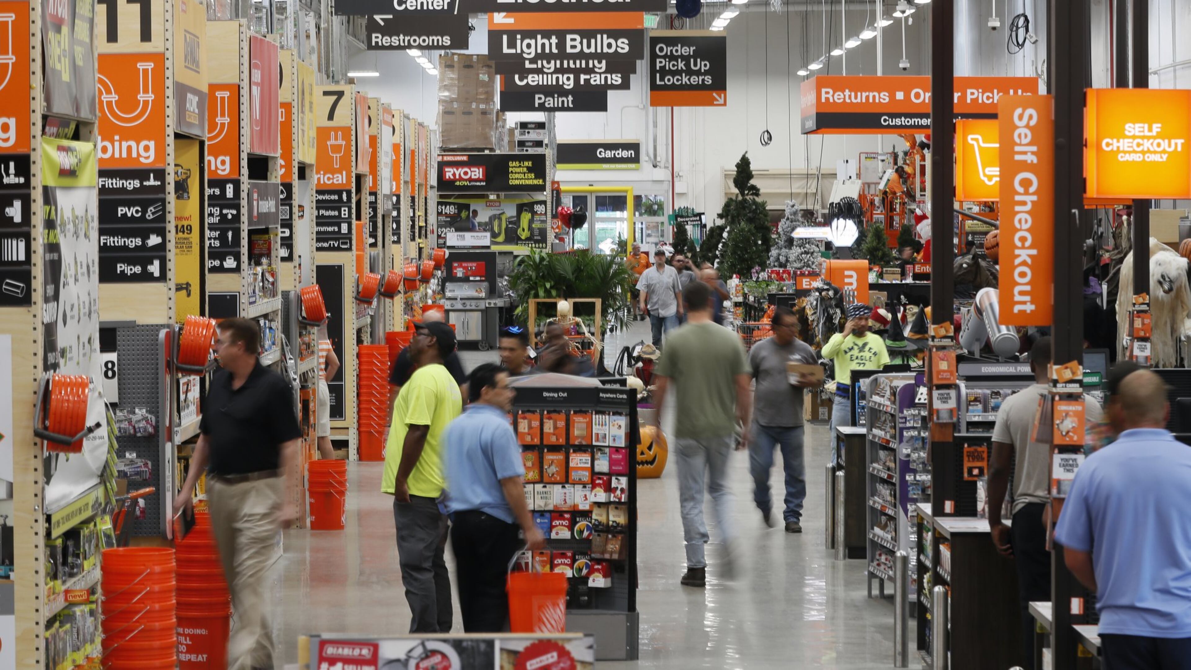 Atlanta customers of Home Depot pass through the “racetrack,” the busiest aisle that is by the registers. Home Depot is the largest company headquartered in Georgia. Bob Andres / robert.andres@ajc.com