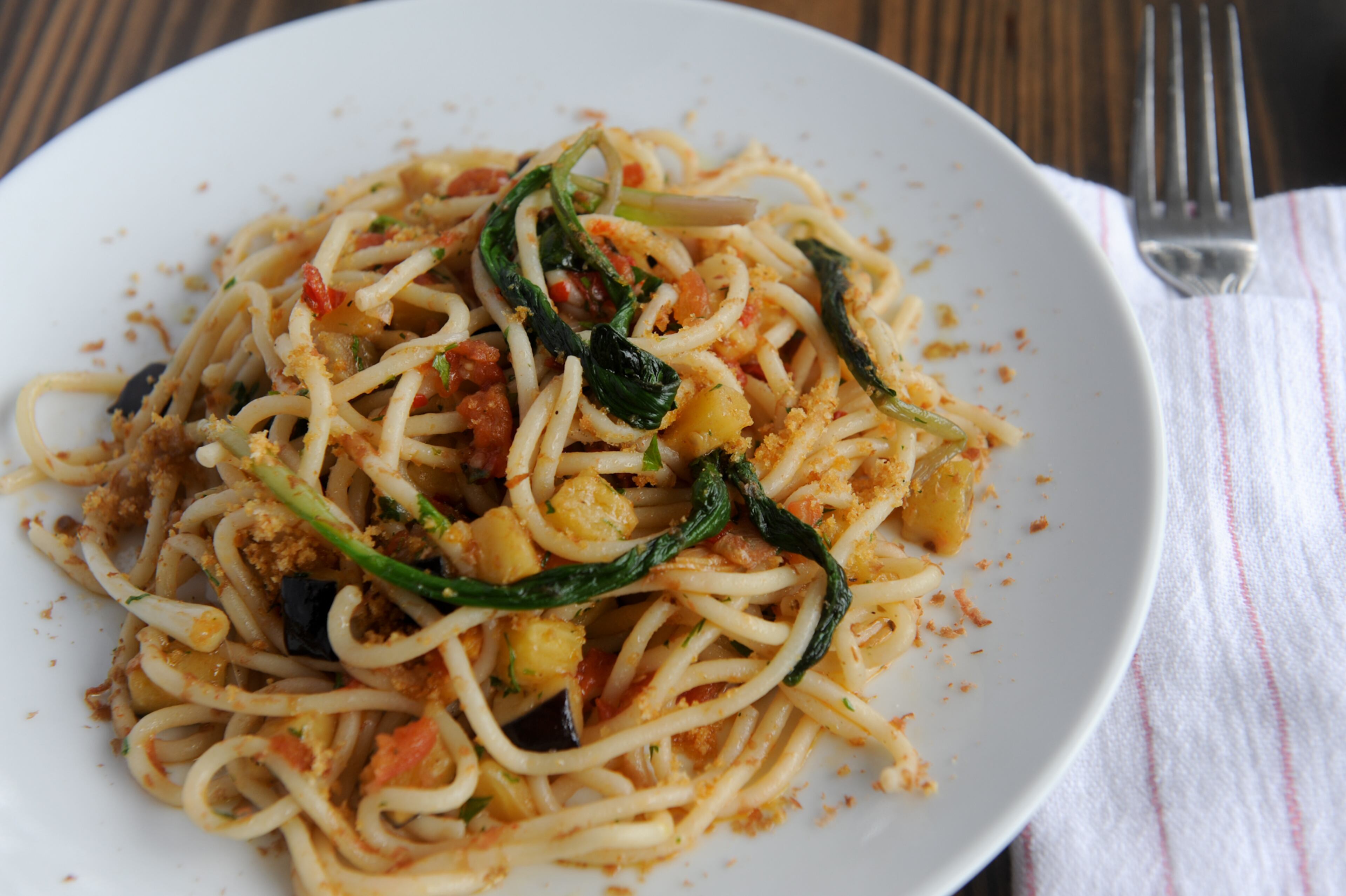 "Pasta is BoccaLupo’s calling card. Unlike other restaurants that hew to a repertoire of classic recipes and a pantry full of imported ingredients, the cooking here is modern Italian American. The prosciutto is proudly Iowan, while the pastas may contain kimchi or field peas."