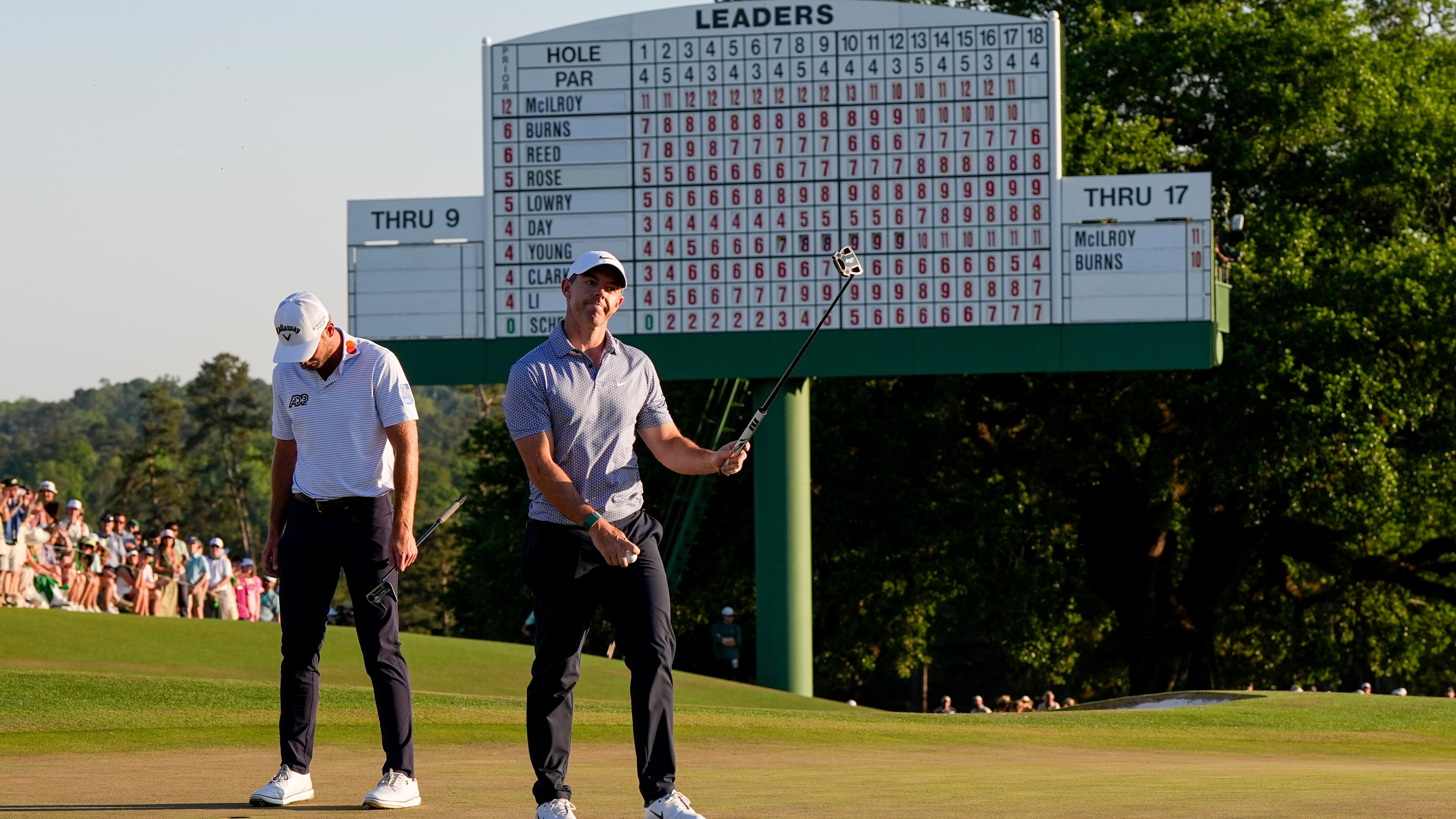 Rory McIlroy, of Northern Ireland, waves after his putt on the 18th hole during the third round of the Masters golf tournament at the Augusta National Golf Club, Saturday, April 11, 2026, in Augusta, Ga. (AP Photo/David J. Phillip)