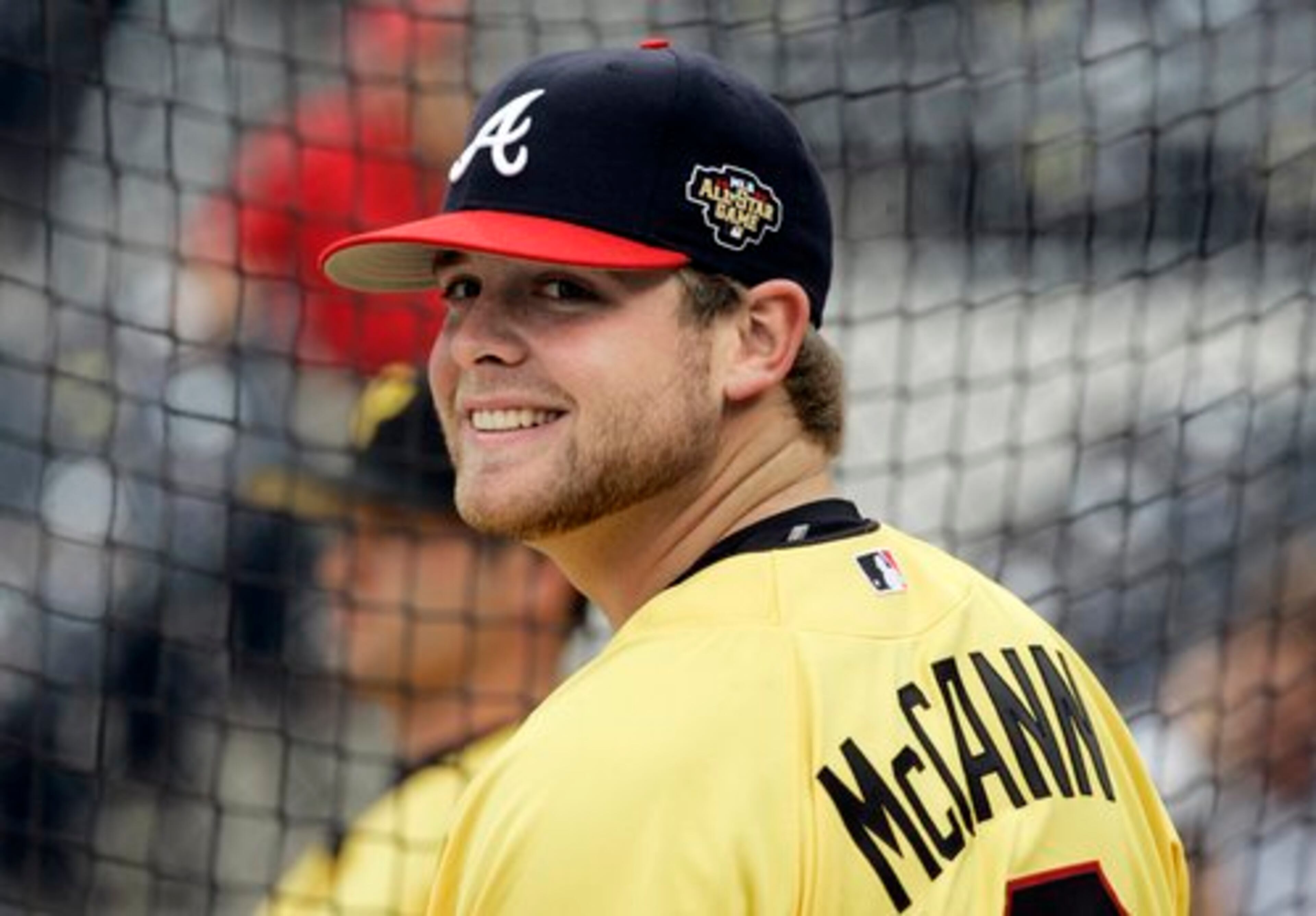 Atlanta Braves catcher Brian McCann, of the Natonal League, smiles during batting practice before the baseball All Star Game in Pittsburgh, Tuesday, July 11, 2006.(AP Photo/Charles Krupa)