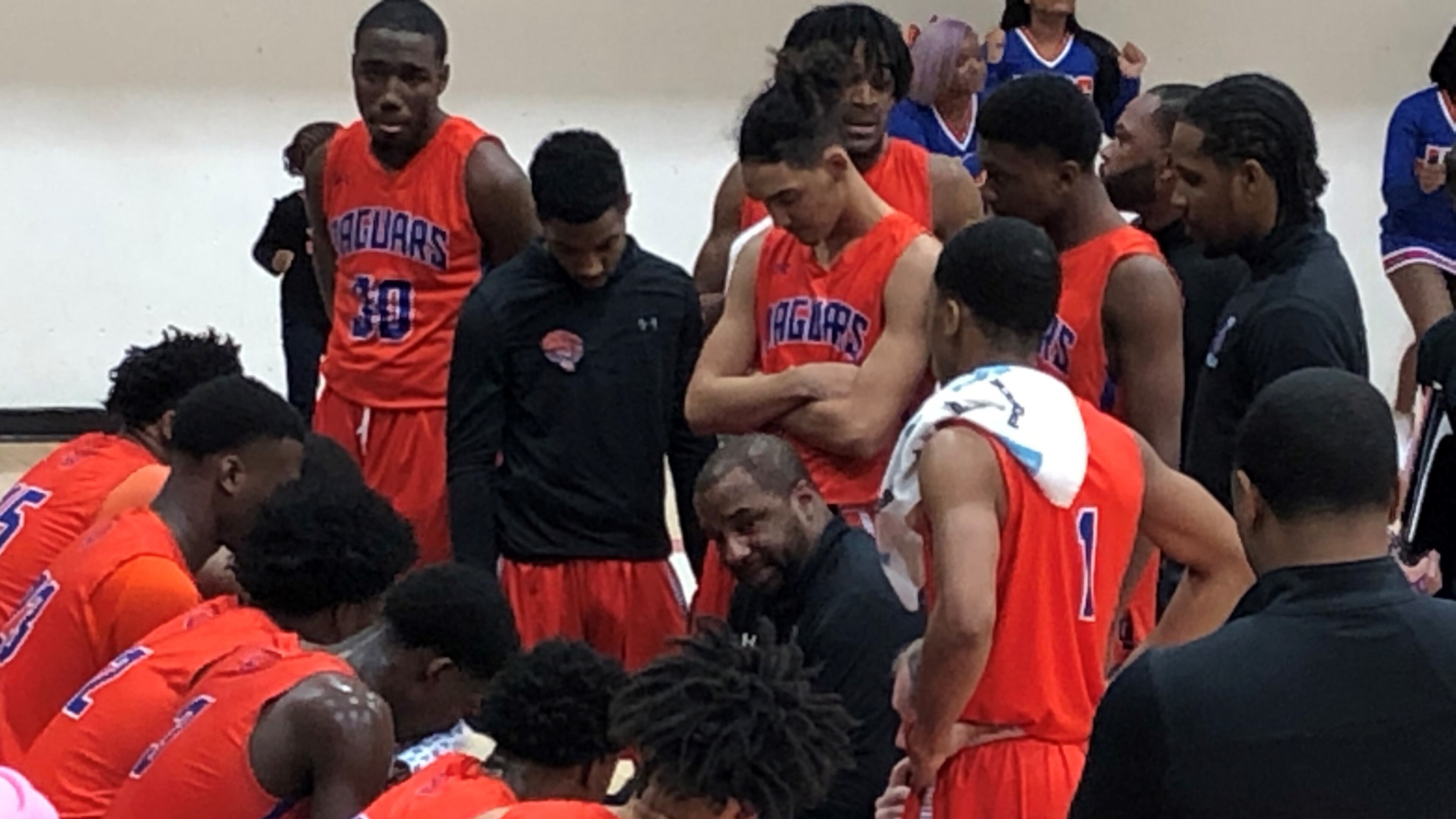 Coach L’Dreco Thomas talks to his Cedar Shoals team during a timeout.