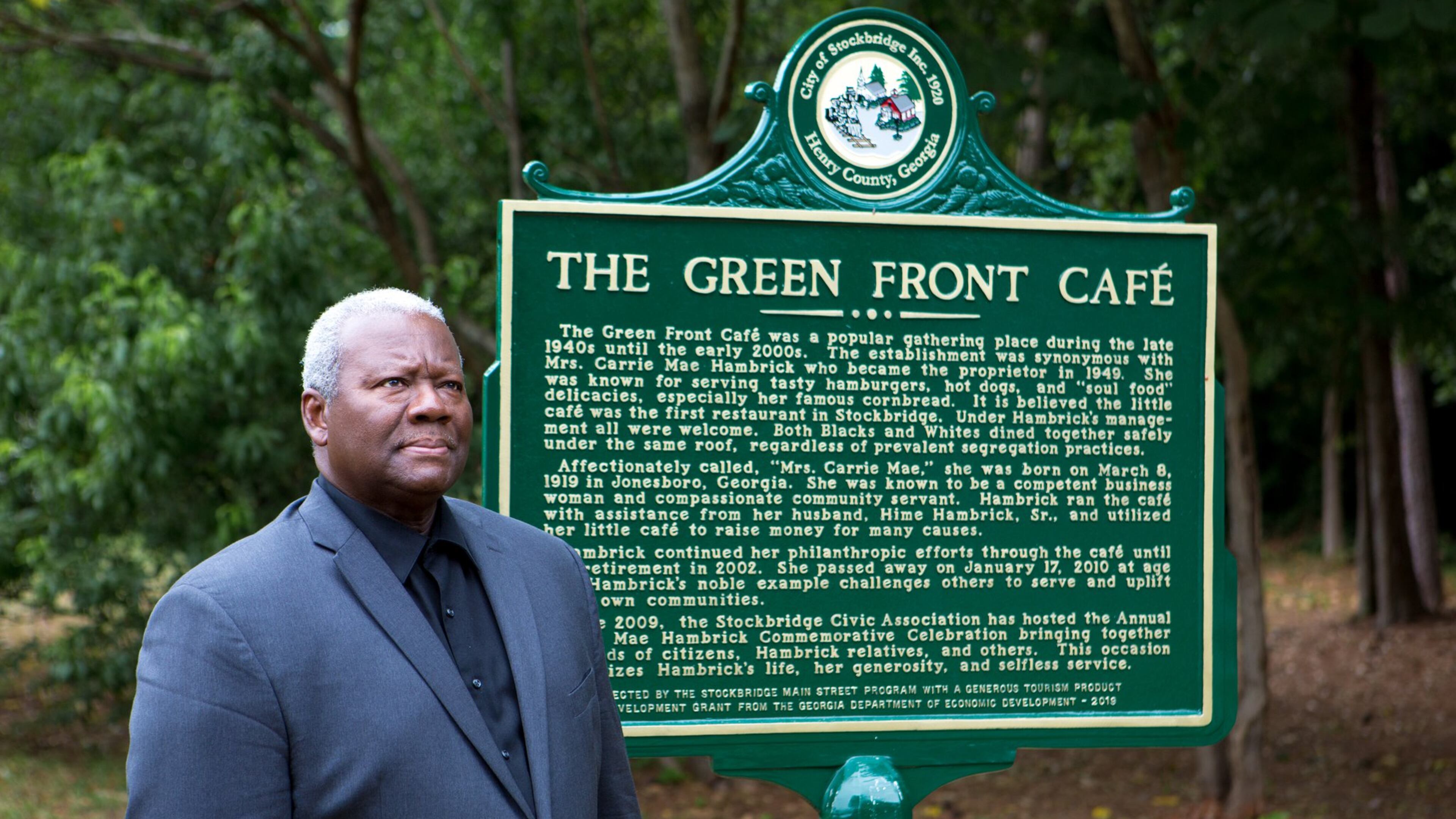 Stockbridge City Councilman Alphonso Thomas poses for a portrait next to a historical marker for Green Front Cafe next to the building in Stockbridge, Ga., on Tuesday, June 4, 2019. Thomas grew up with the cafe and fondly recalled his childhood in the neighborhood. The small building is a well-loved community fixture that thrived under the ownership of Carrie Mae Hambrick, who Thomas worked for, and served as a town watering hole from its opening in 1947 through the early 2000s. The cafe is now in the process of being revived under the ownership of Diane Miller. (Casey Sykes for The Atlanta Journal-Constitution)