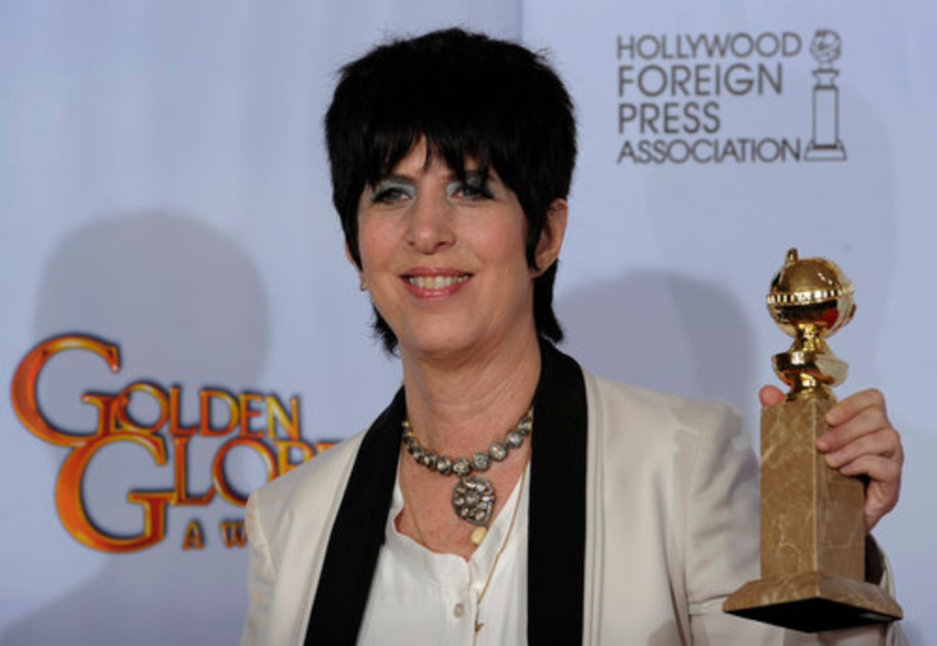 Diane Warren holds up her award for Best Original Song - Motion Picture for "You Haven't Seen the Last of Me" from the film "Burlesque" at the Golden Globe Awards Sunday, Jan. 16, 2011, in Beverly Hills, Calif.