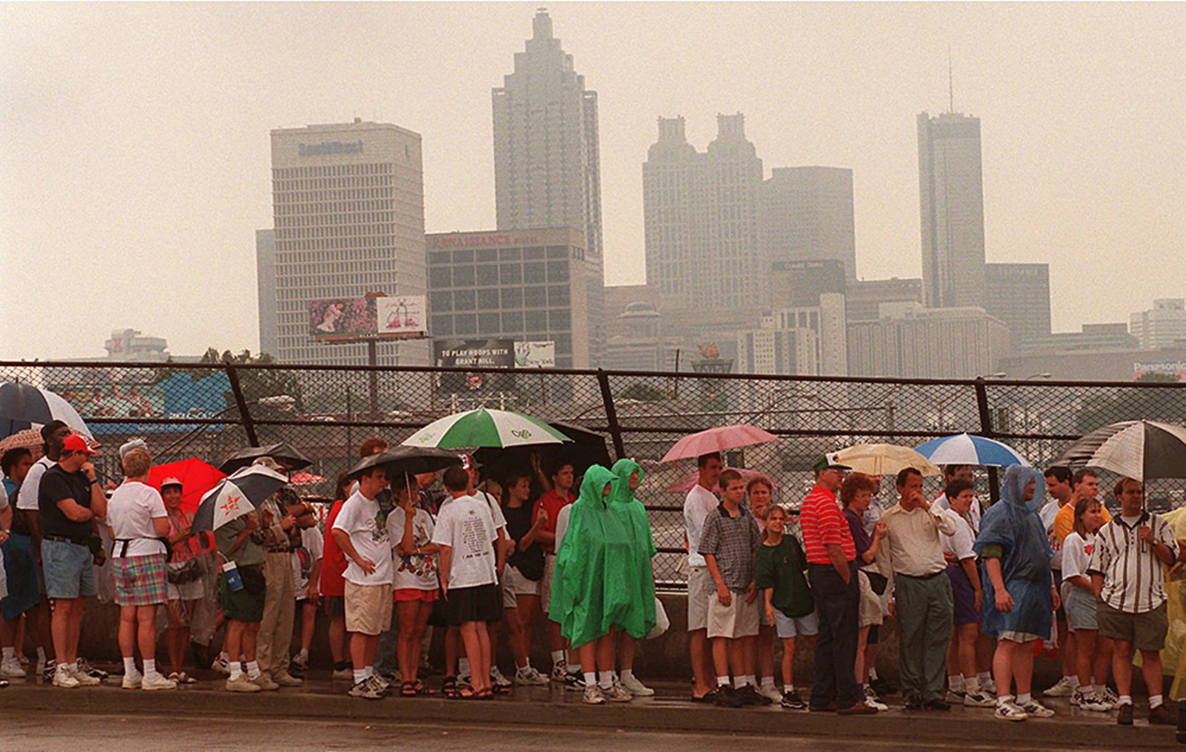 This July 27, 1996, photo of the Atlanta skyline was taken as Olympic fans line up to enter the Alexander Memorial Coliseum to see boxing at the 1996 Summer Olympic Games. (AP Photo/Rick Bowmer, File)