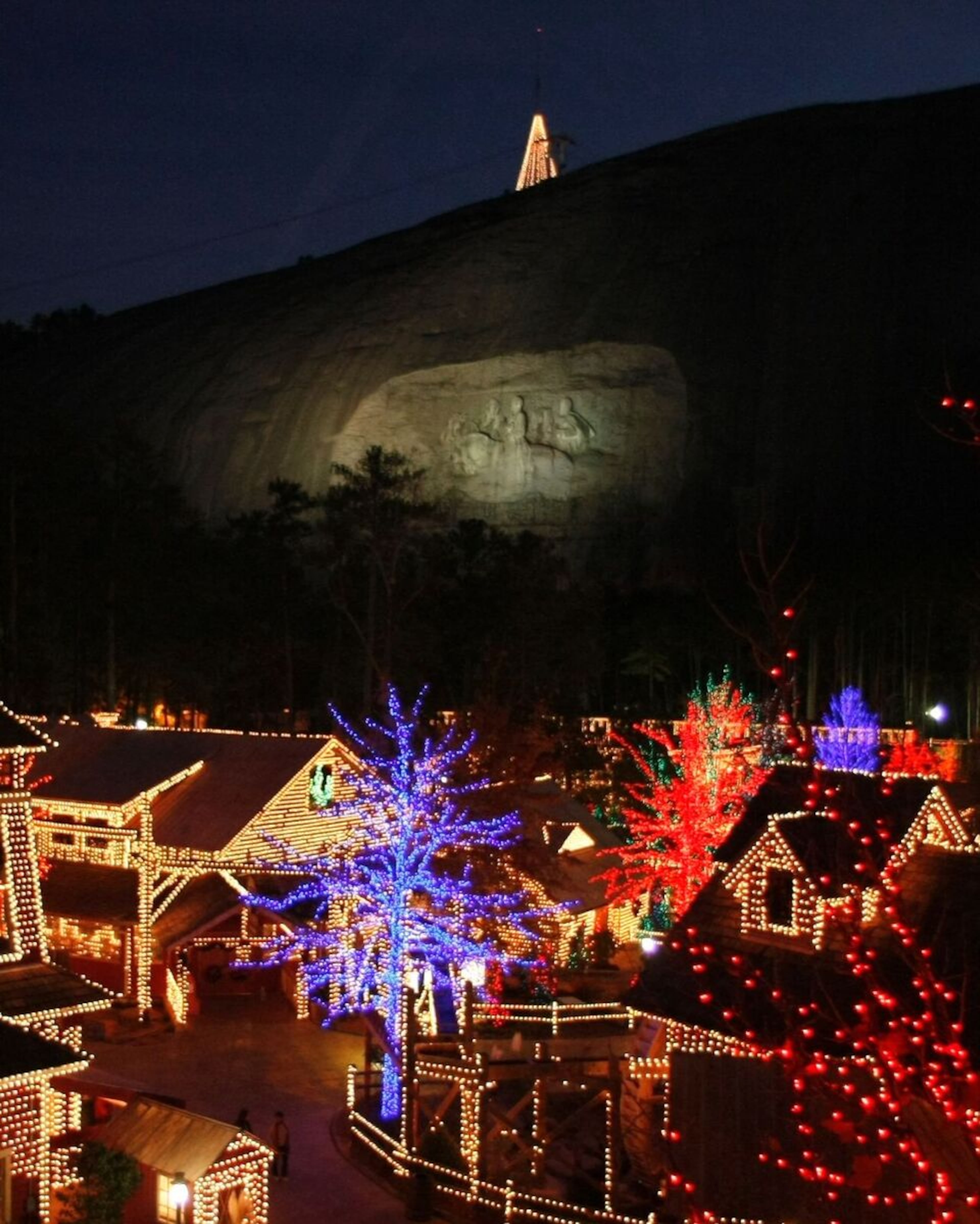 Buildings in the Crossroads attraction at Stone Mountain Park are bedecked in Christmas lights and decorations, shown on Thursday, Dec. 4, 2008. ALLEN SULLIVAN / (FILE)