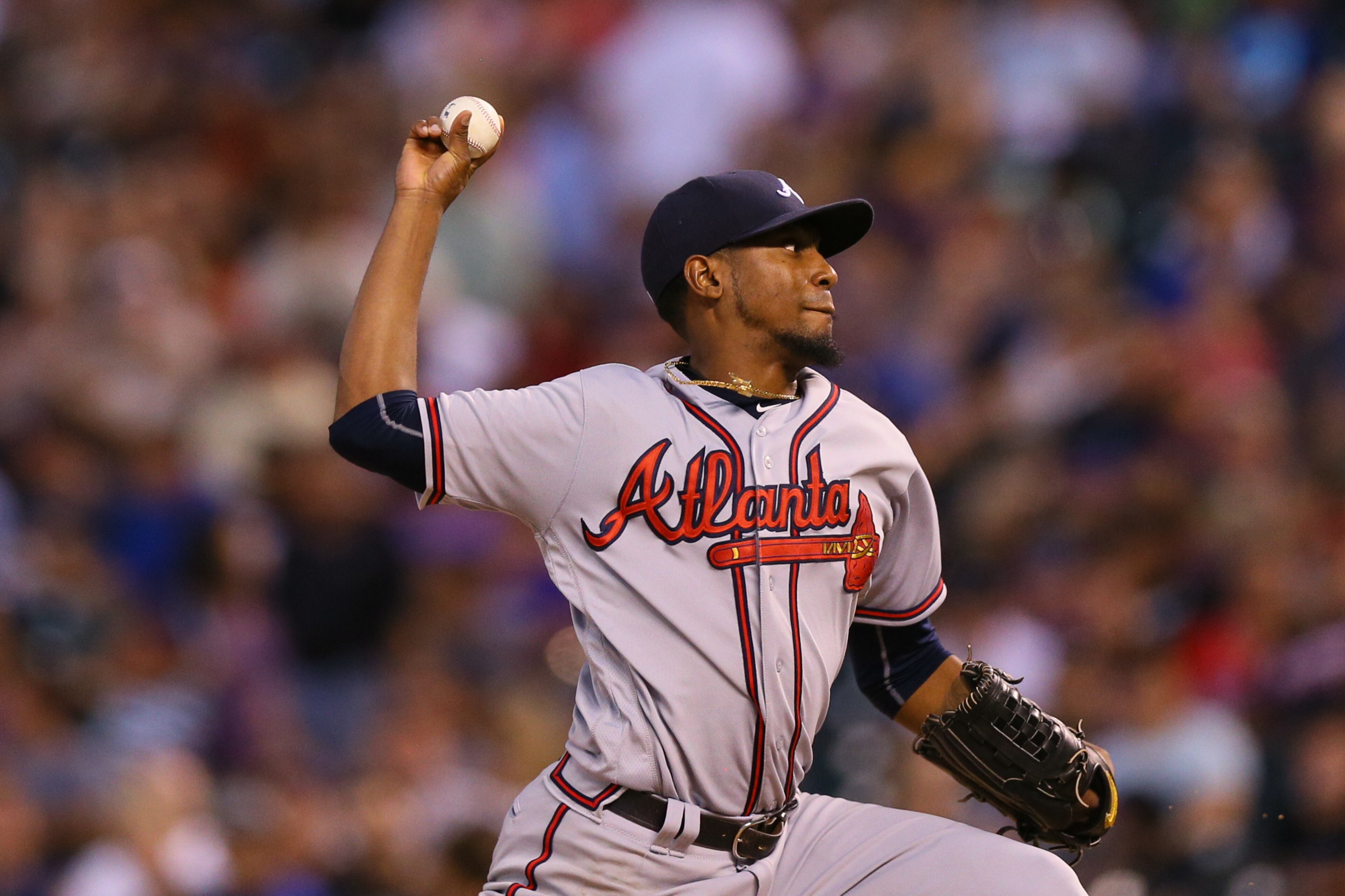 DENVER, CO - JULY 22: Starting pitcher Julio Teheran #49 of the Atlanta Braves delivers to home plate during the third inning against the Colorado Rockies at Coors Field on July 22, 2016 in Denver, Colorado. (Photo by Justin Edmonds/Getty Images)