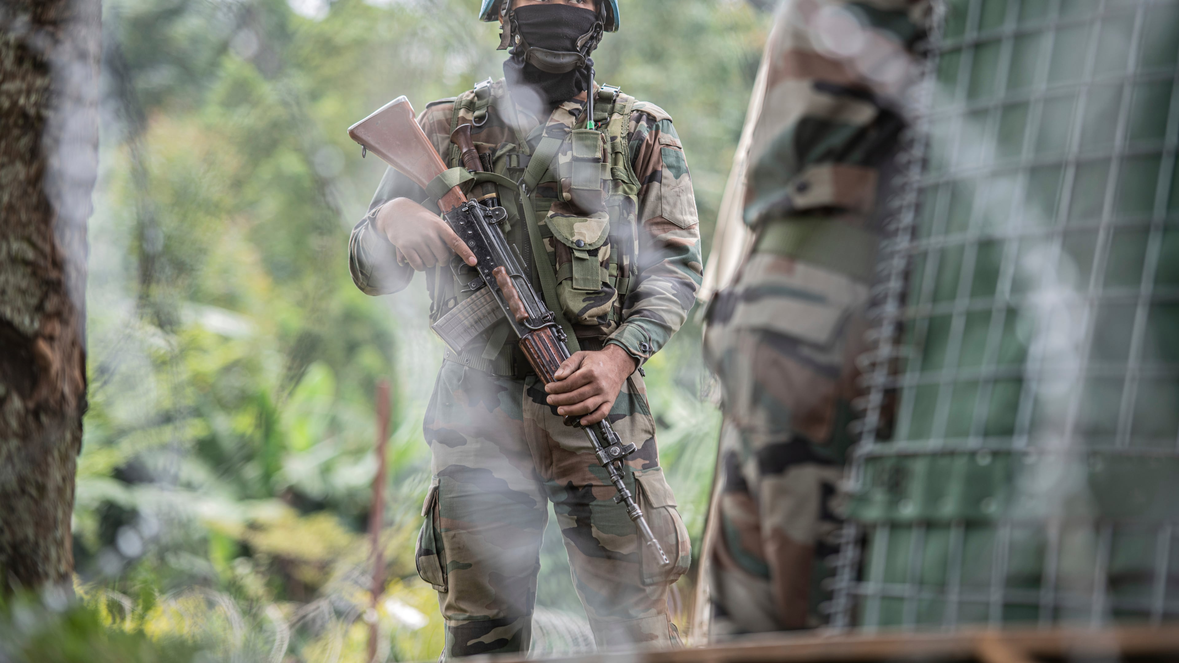 FILE - A MONUSCO blue helmet deployed near Kibumba, north of Goma, Democratic Republic of Congo, on Jan. 28, 2022. (AP Photo/Moses Sawasawa, File)