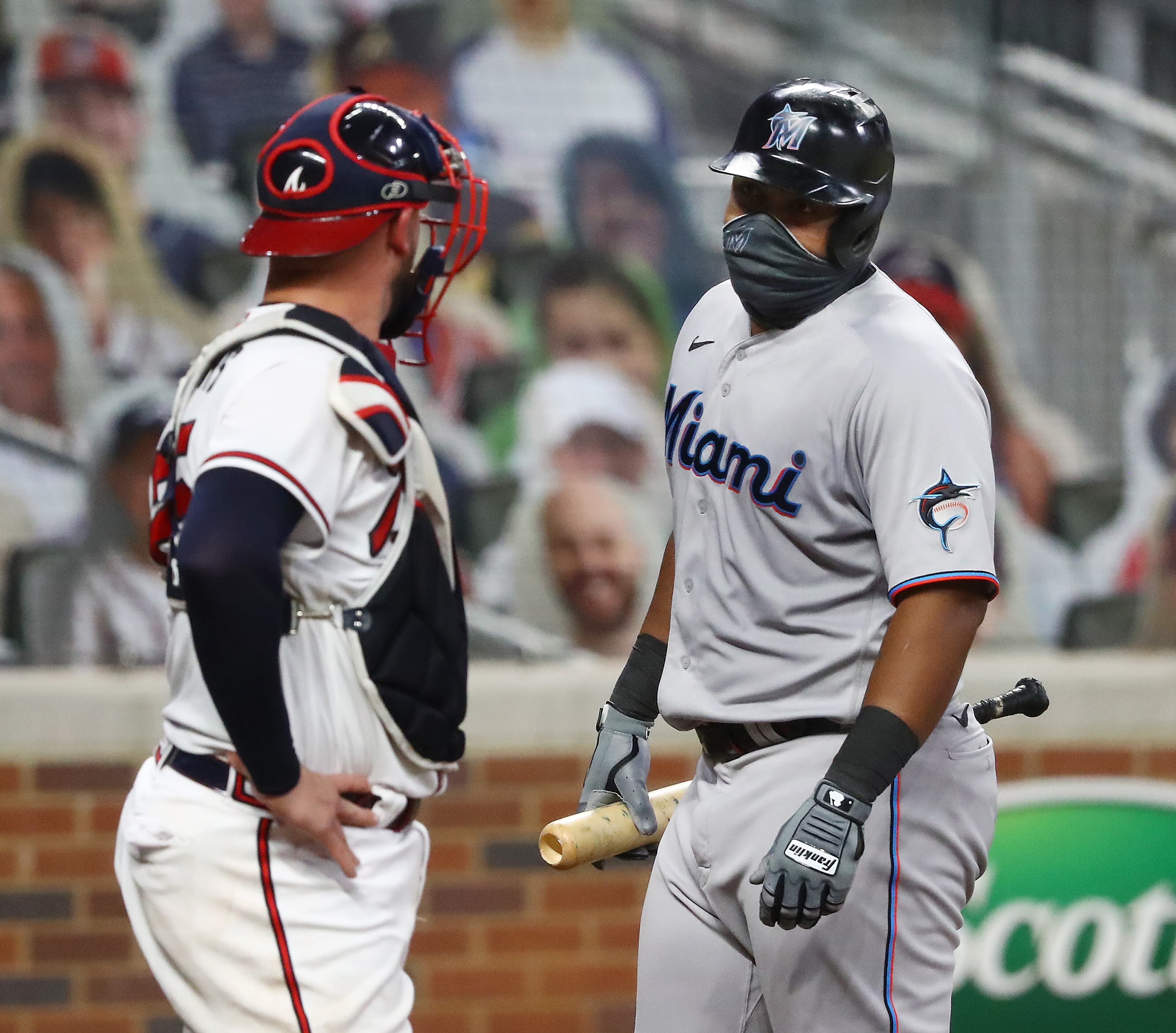Atlanta Braves catcher Tyler Flowers and Miami Marlins batter Jesus Aguilar exchange words during the fifth inning in a MLB baseball game on Tuesday, Sept. 8, 2020 in Atlanta. “Curtis Compton / Curtis.Compton@ajc.com”