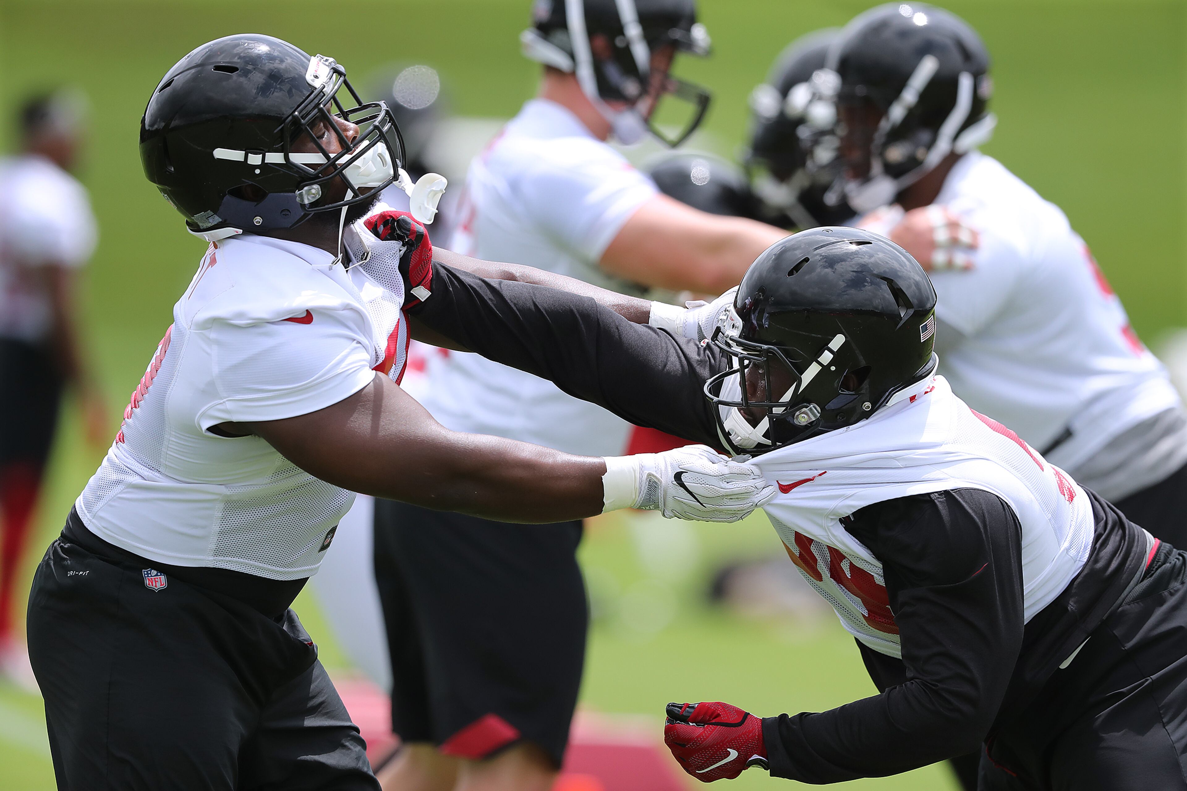 May 30, 2018 Flowery Branch: Atlanta Falcons defensive tackles Grady Jarrett (left) and Deadrin Senat get in some line work during organized team activity on Wednesday, May 30, 2018, in Flowery Branch. Curtis Compton/ccompton@ajc.com
