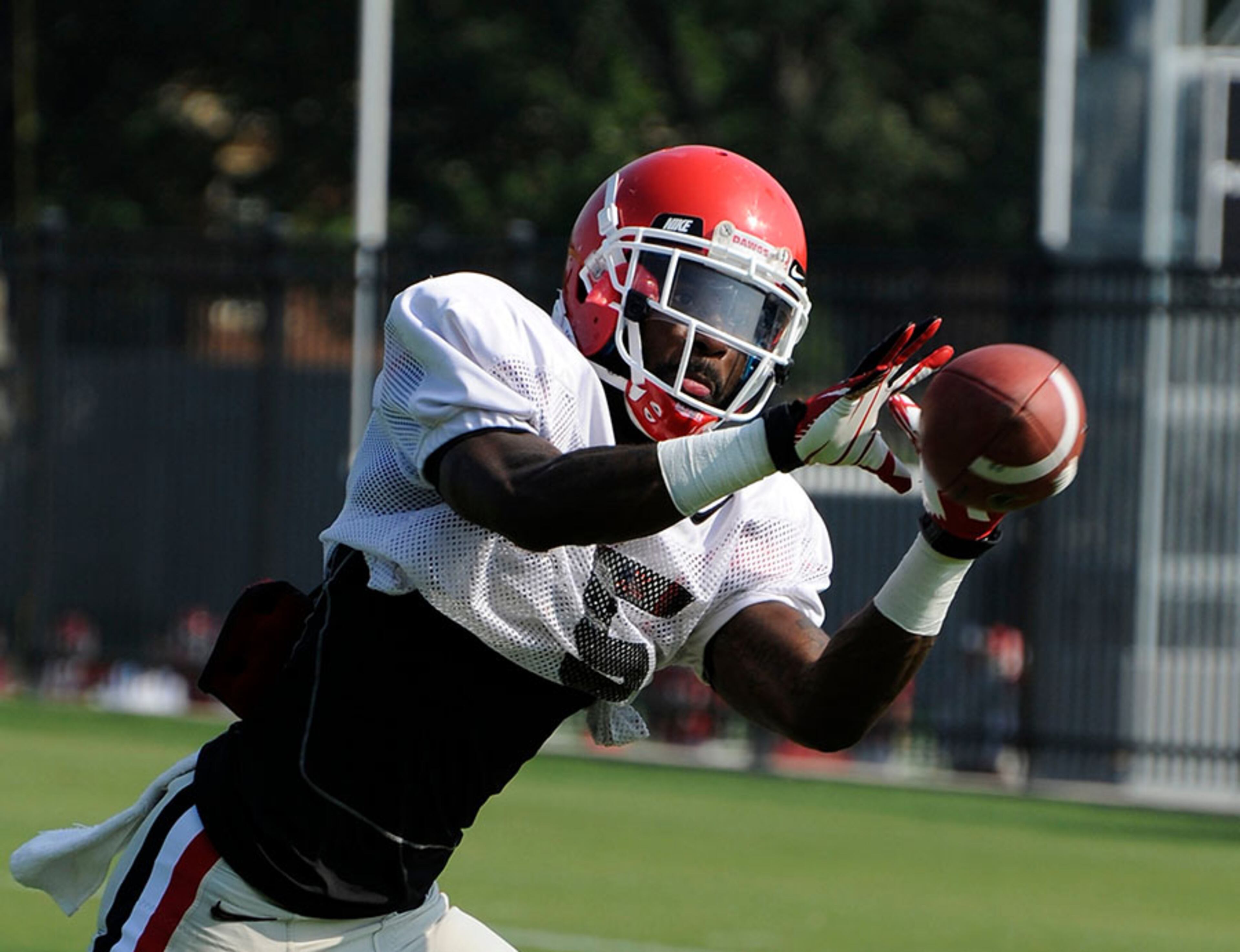 Defensive back Damian Swann catches a pass during Georgia's morning practice Wednesday in Athens.