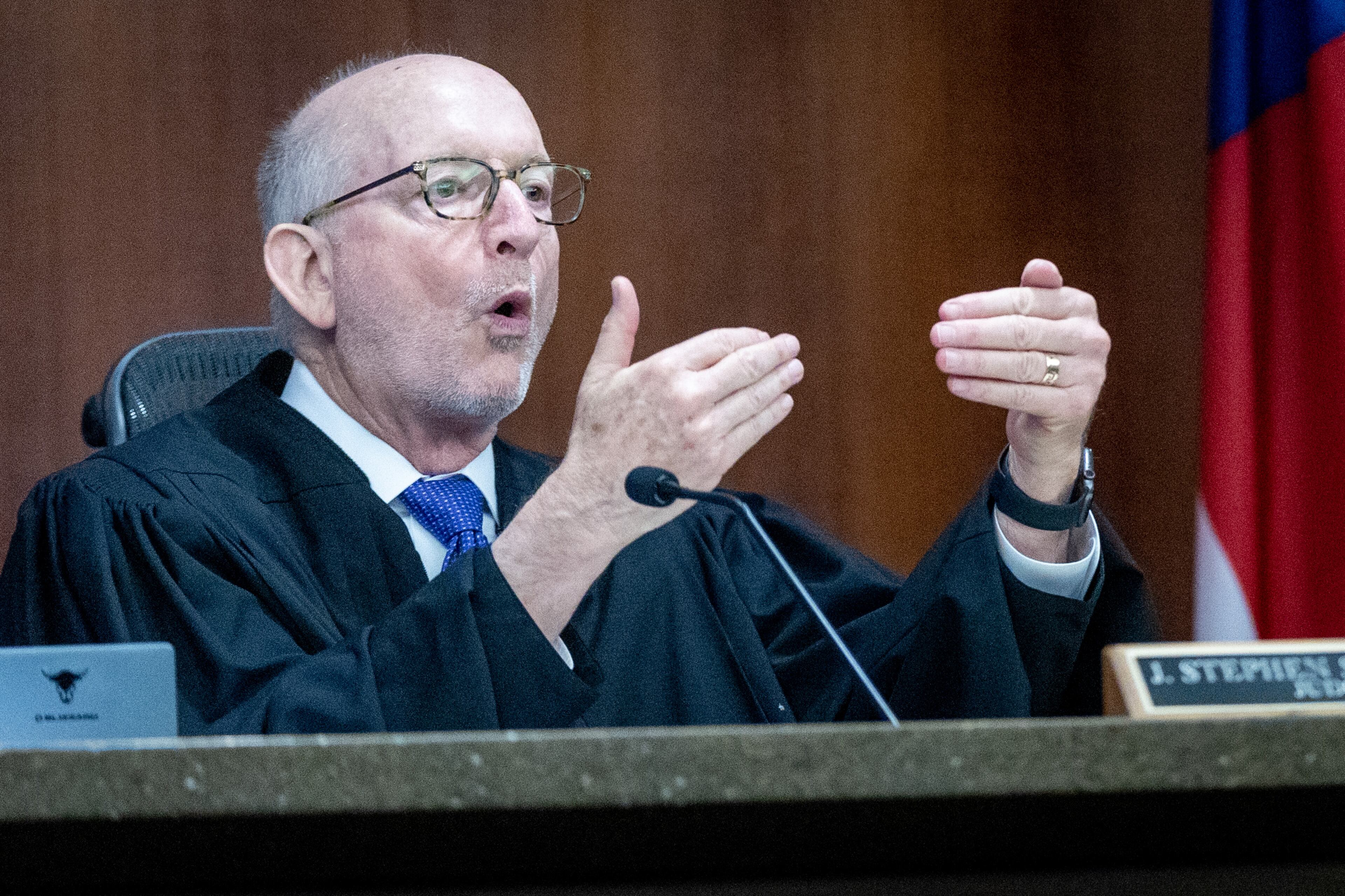 Judge Stephen J. Schuster talks to people in the courtroom during a hearing against the North Georgia Conference of the United Methodist Church in Marietta Tuesday, (Steve Schaefer/steve.schaefer@ajc.com)