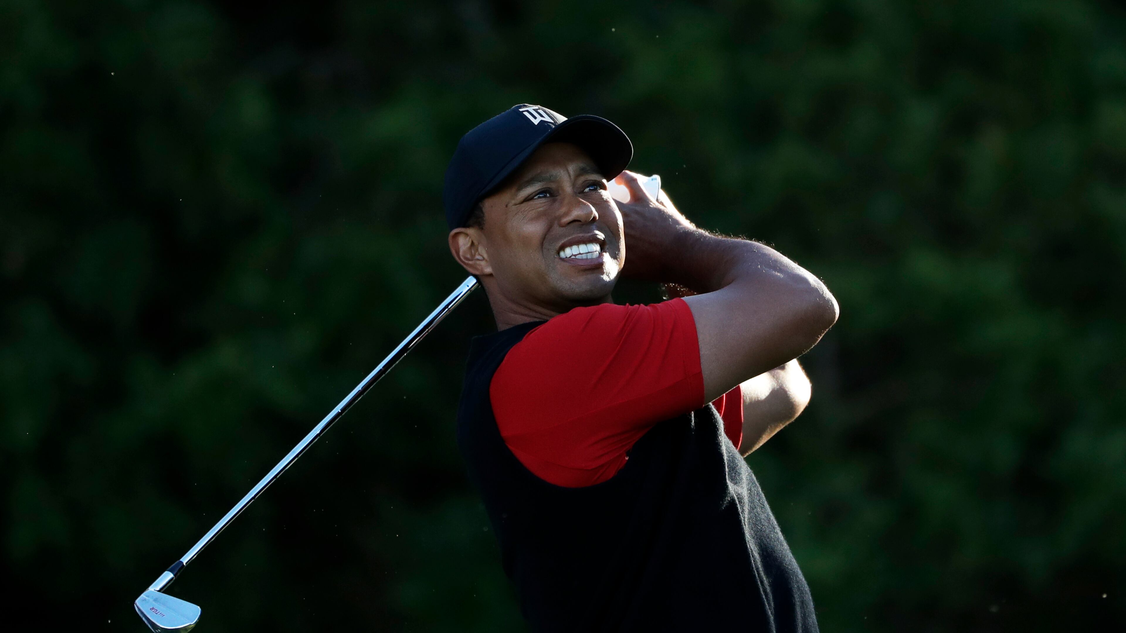 It's Sunday on the PGA Tour and Tiger Woods is wearing red - an encouraging sight. (AP Photo/Gregory Bull)