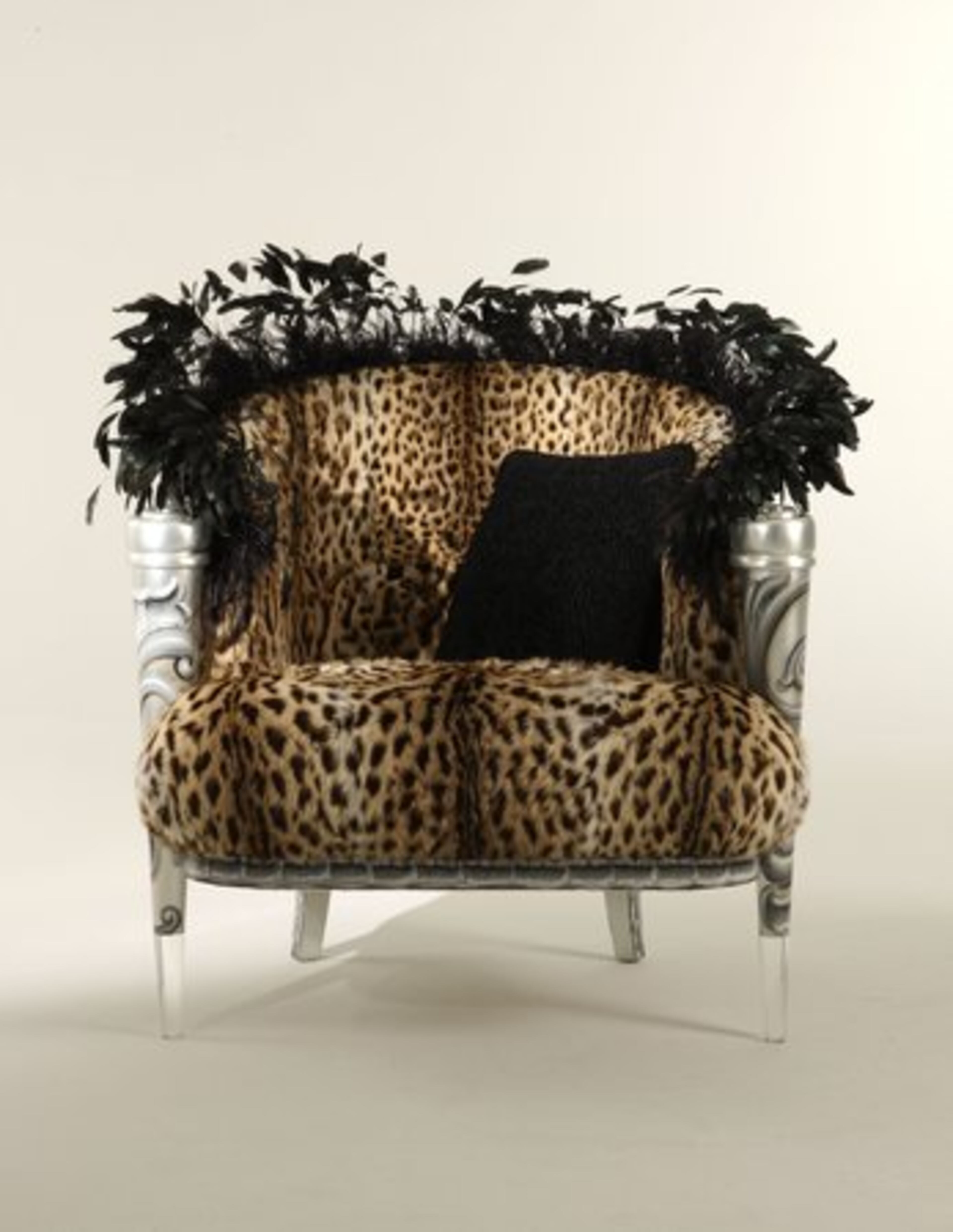 The "Haute Couture" Wild Cat chair is a whimsical bergere upholstered in faux leopard fur and edged in ostrich feathers, with custom painted design and front lucite legs. It was designed by Carlo Rampazzi and handmade in Italy. It retails for more than $26,000.
