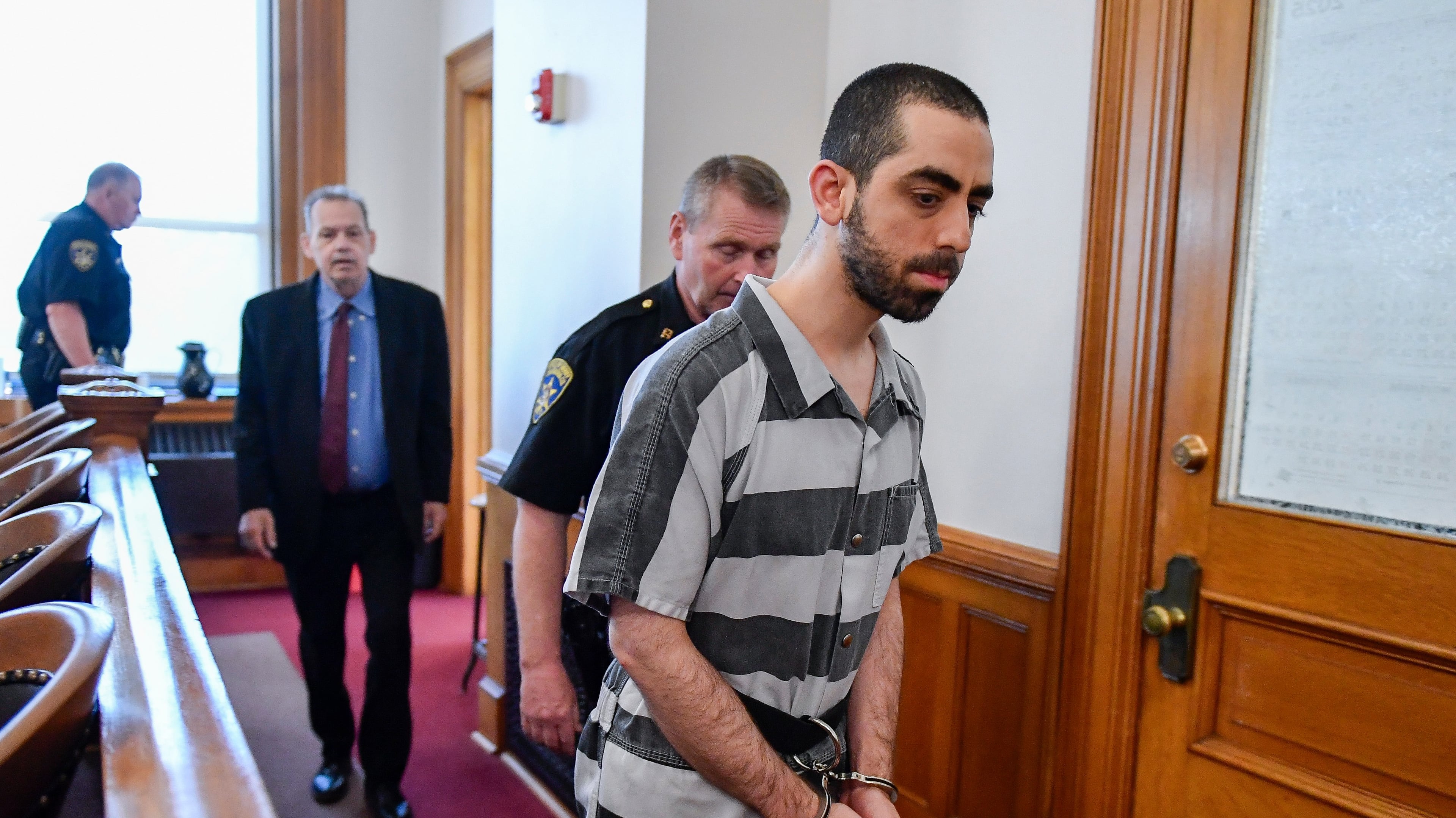 FILE - Hadi Matar walks in to the Chautauqua County court in Mayville, N.Y., May, 16, 2025. (AP Photo/Adrian Kraus, File)
