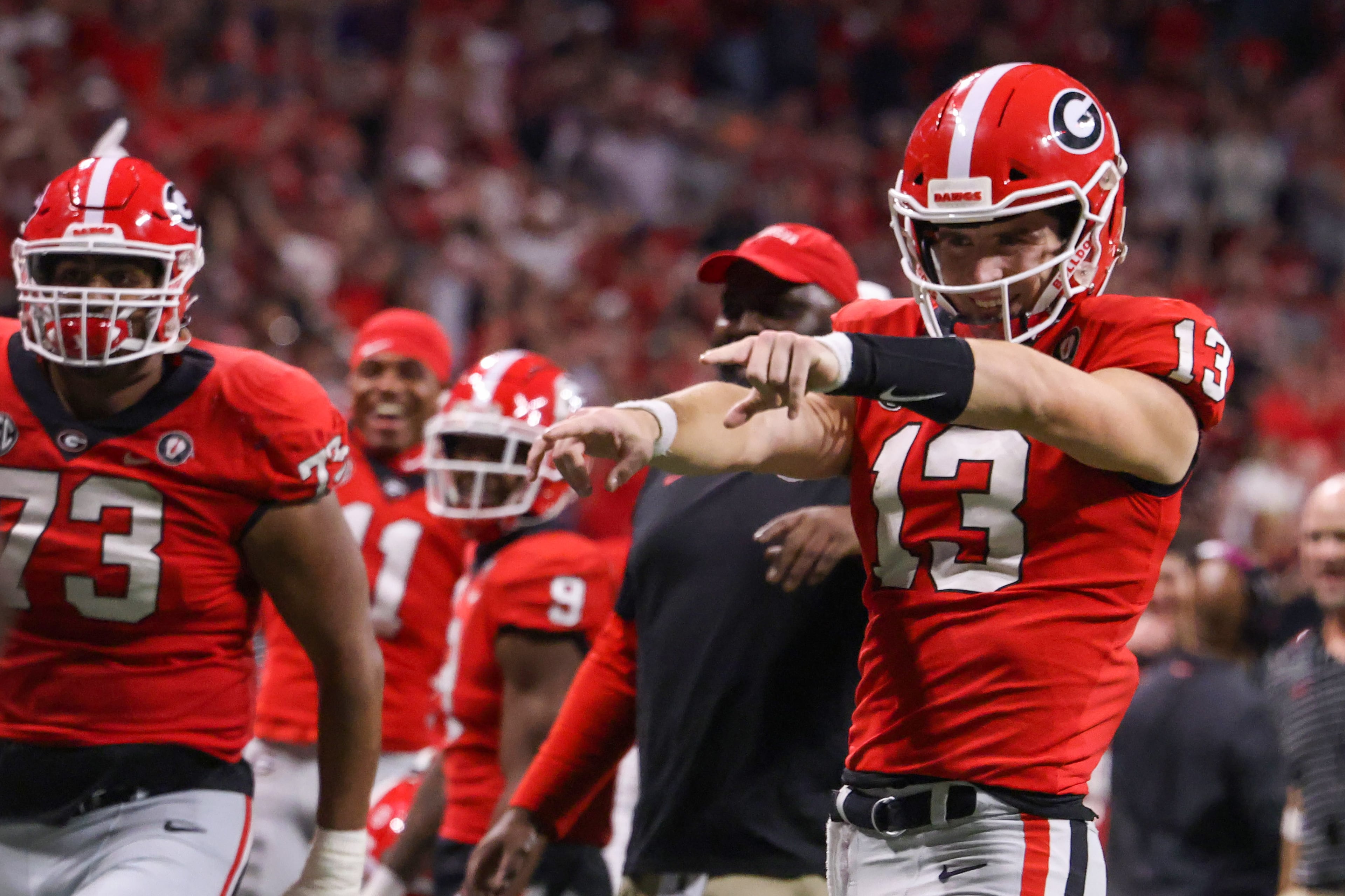 Georgia Bulldogs quarterback Stetson Bennett (13) gestures to the sidelines during the second half of the SEC Championship Game against the LSU Tigers at Mercedes-Benz Stadium in Atlanta on Saturday, Dec. 3, 2022. (Jason Getz / Jason.Getz@ajc.com)