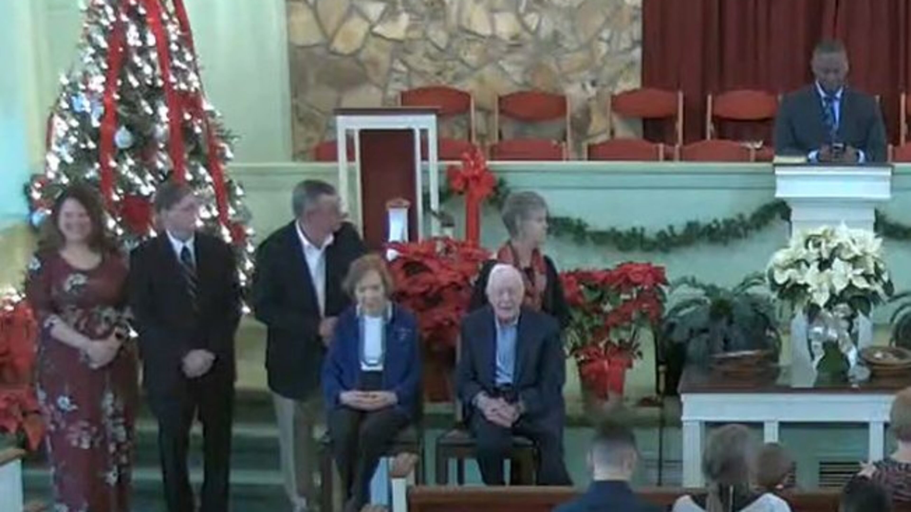 Former President Jimmy Carter and first lady Rosalynn Carter are seated at left in front of the congregation for a moment during the morning service at Maranatha Baptist Church in Plains on Sunday, December 29, 2019. (Photo from Maranatha Baptist livestream)